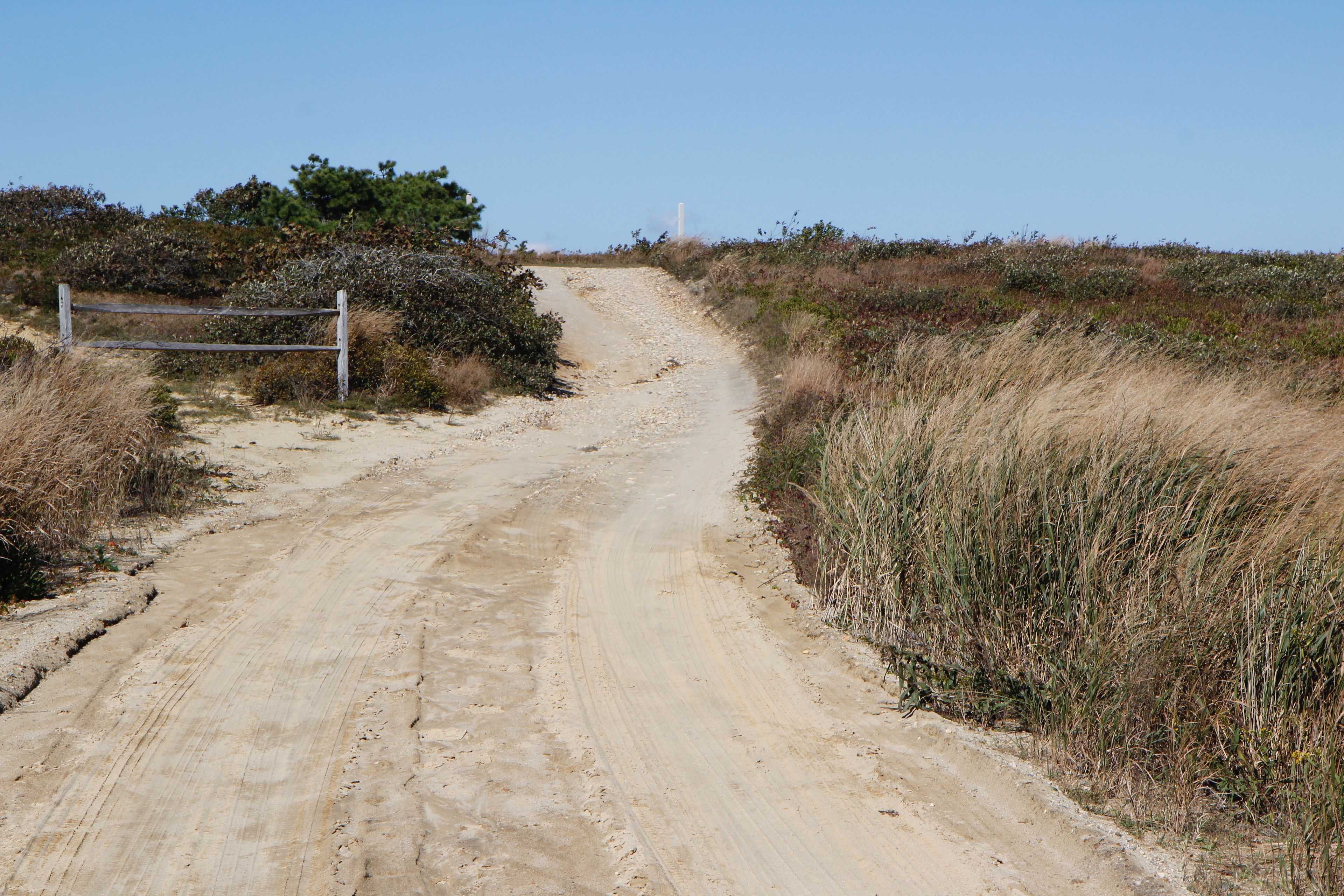 dirt road up from beach parking to east