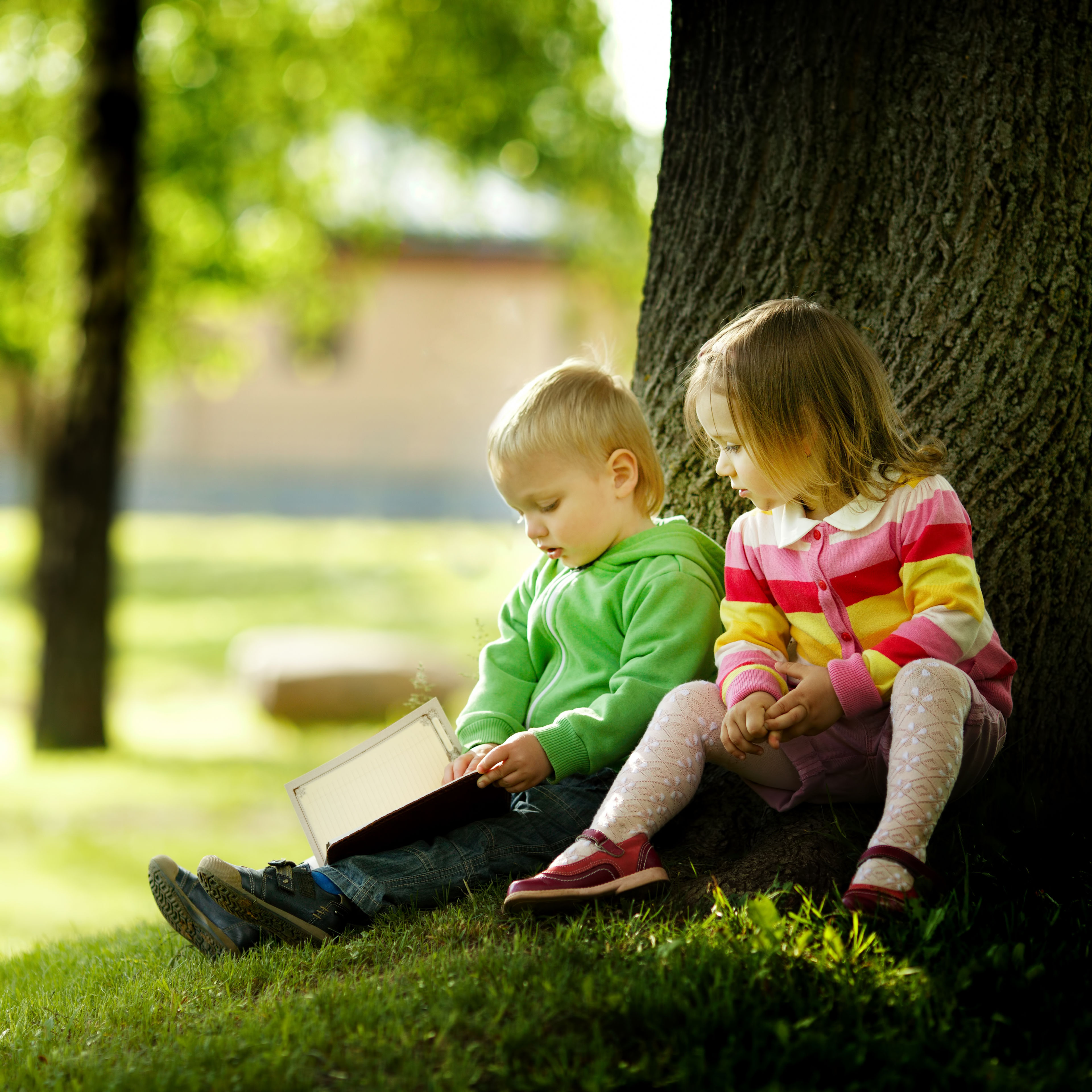 cute-boy-and-girl-reading-a-book-P5EJYTU.jpg