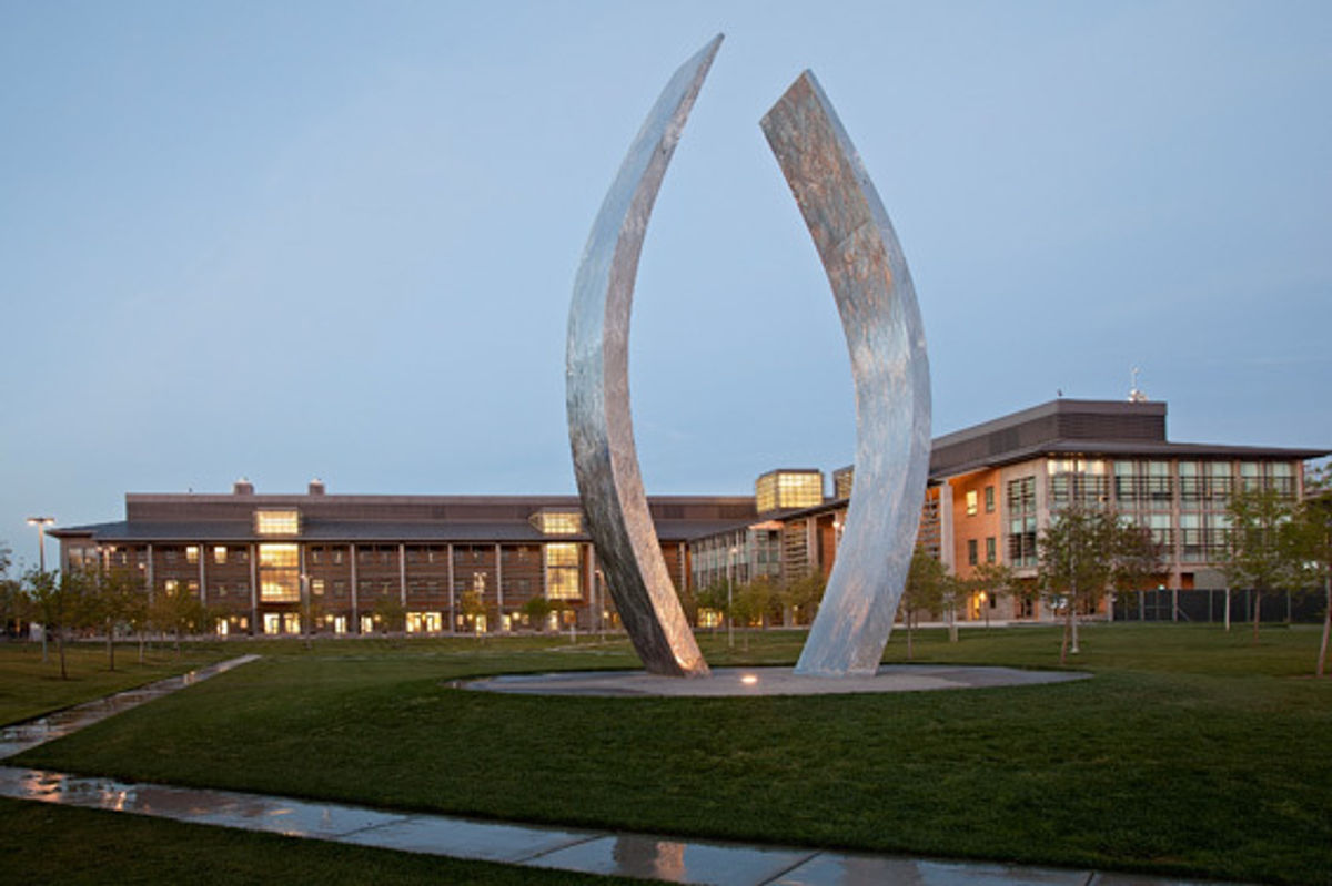 Conceived by noted American sculptor Aris Demetrios, "Beginnings" consists of two gently curving, vertical stainless steel arms, each about 40 feet high, rising from a large circular base.