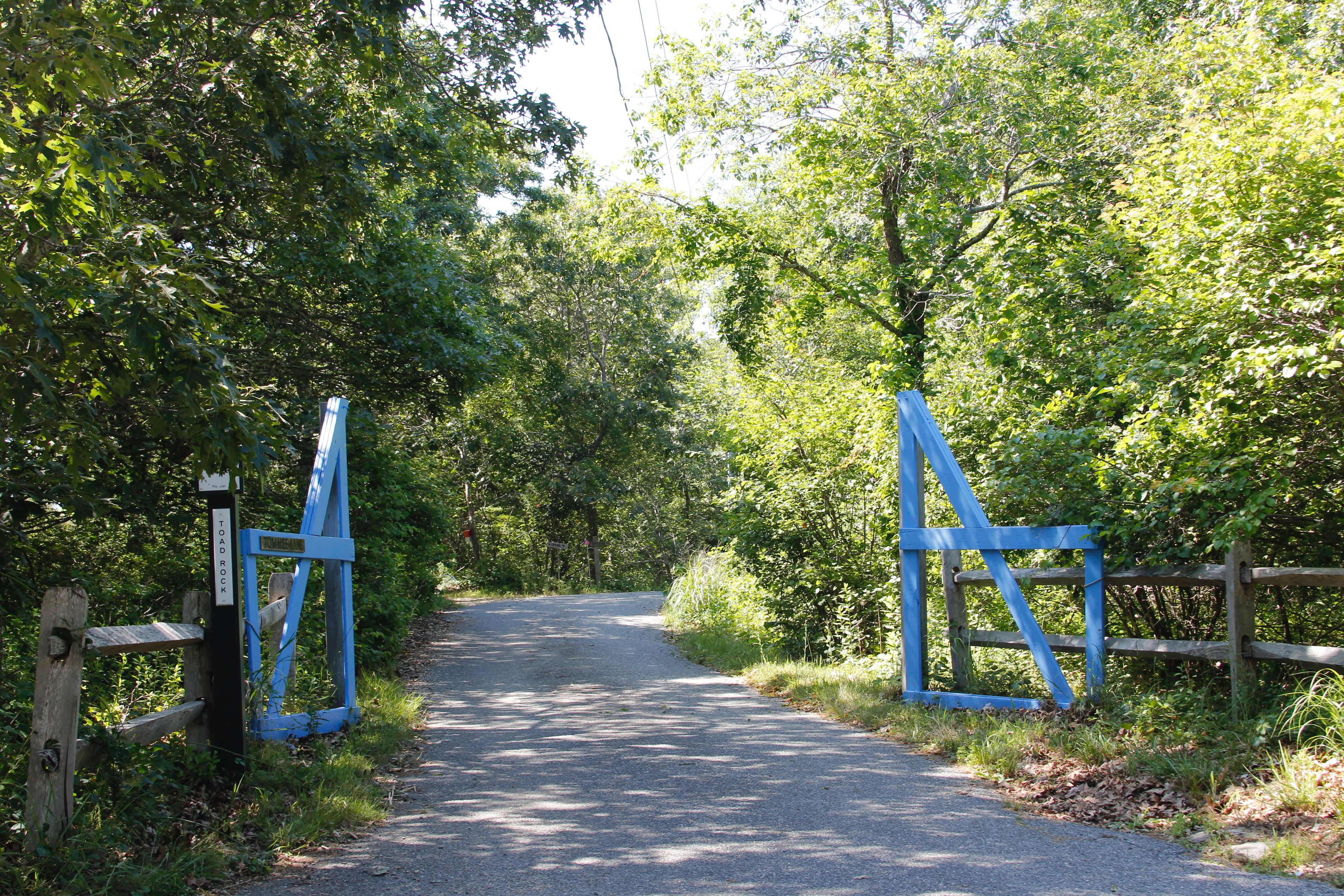 blue gates at Towhee Lane/Moshup Trail intersection