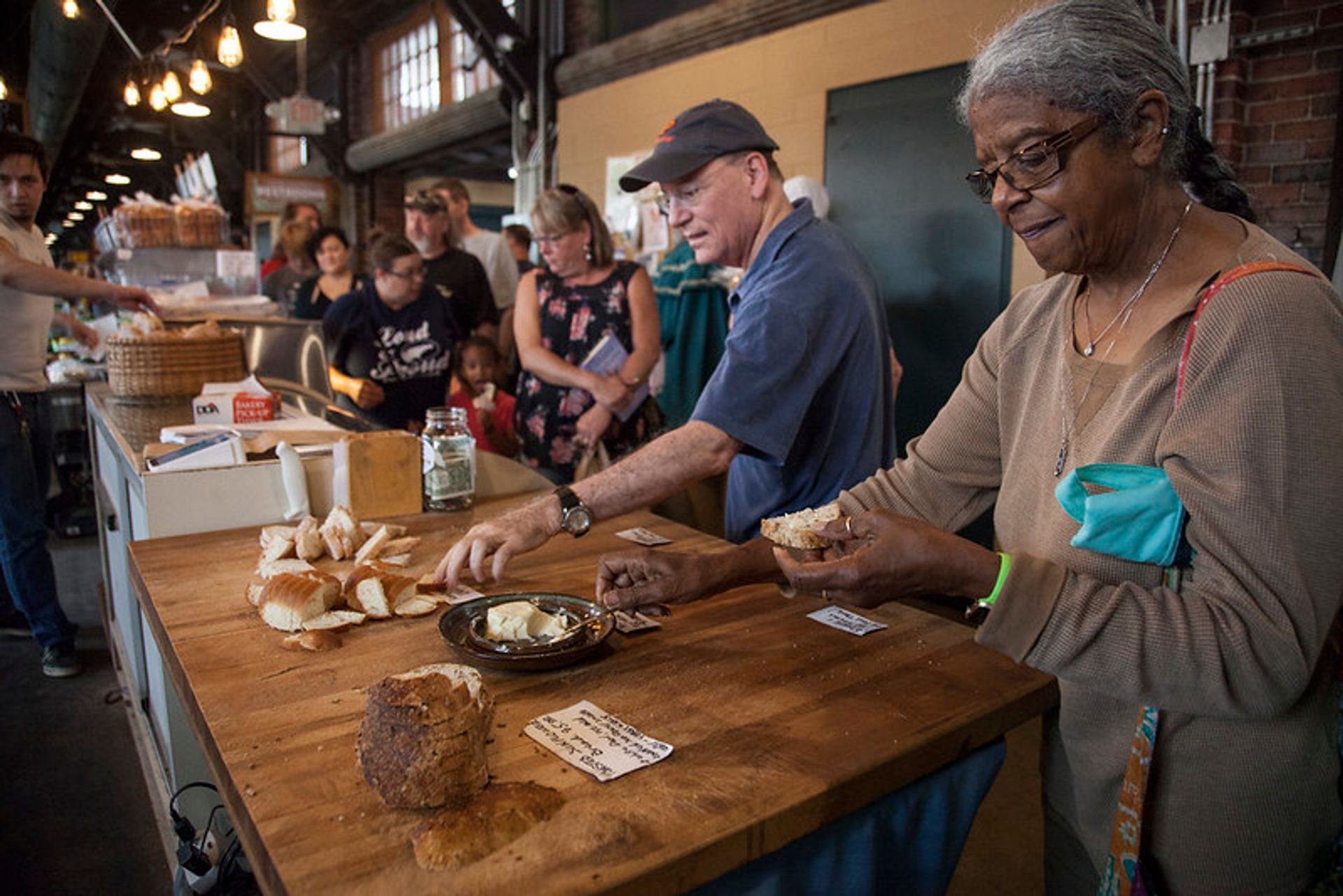 Bakers offer samples to Market visitors