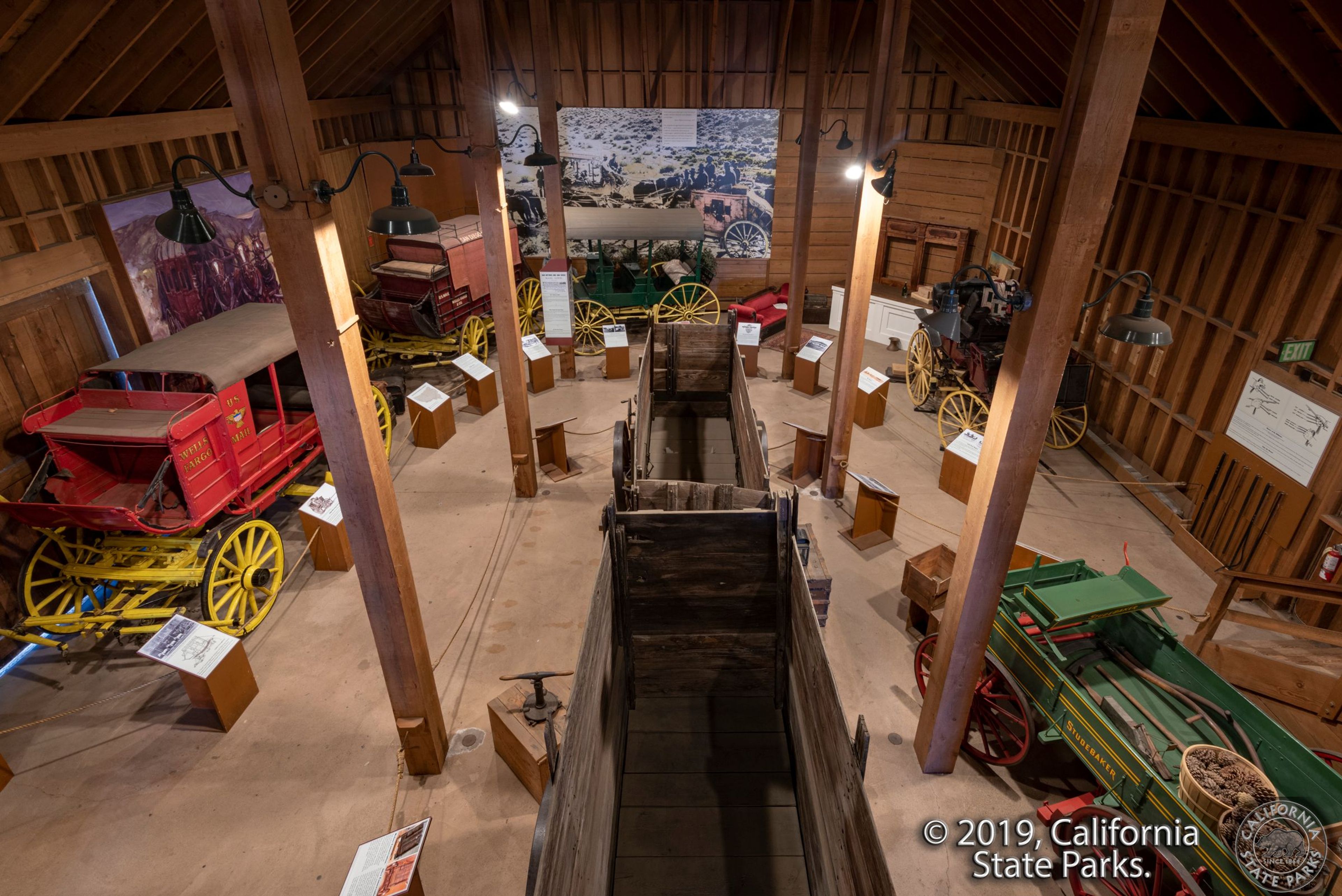 Photo from the loft of the Seeley Stable Museum showing some of the wagons and carriages of the Roscoe E "Pappy" Hazard Collection.