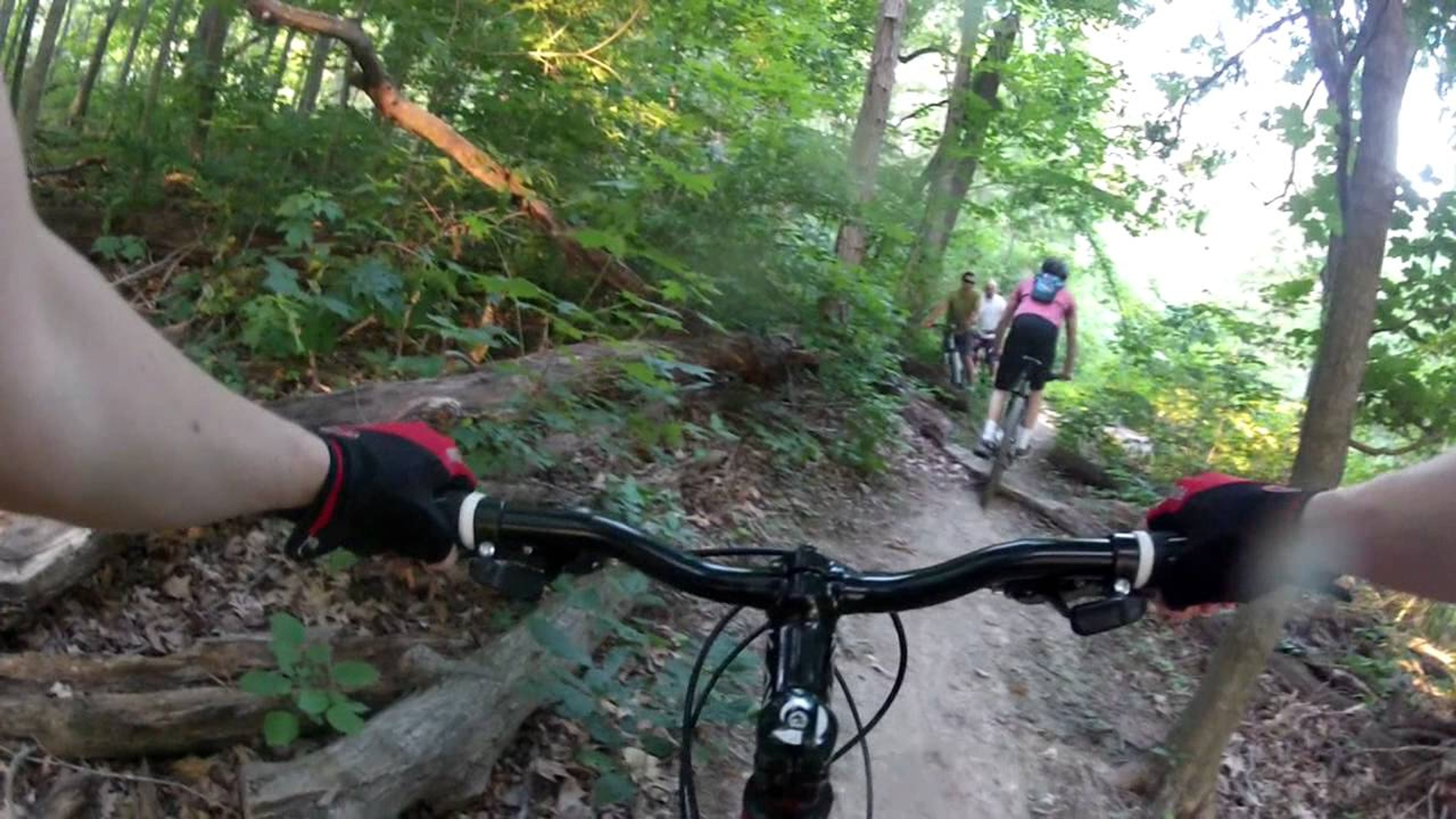 Park patrons riding bikes on Wapehani Mountain Bike Park trails.