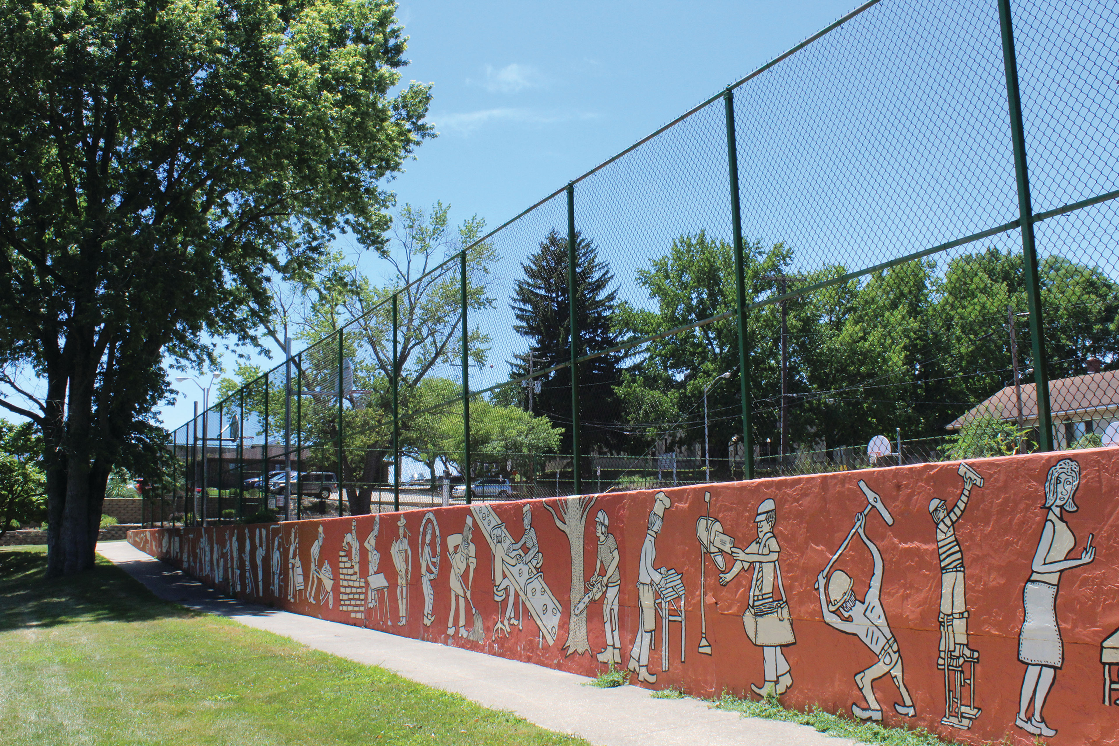 the mural next to the basketball courts in Building and Trades Park