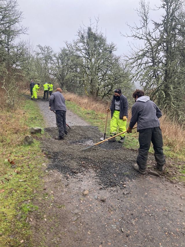 NCCC crew members work to construct rolling dips on lower Trail 7