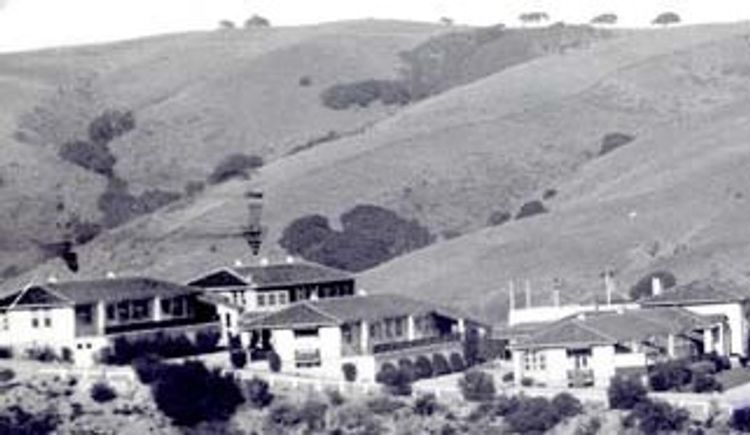 historic picture of buildings and hillside 