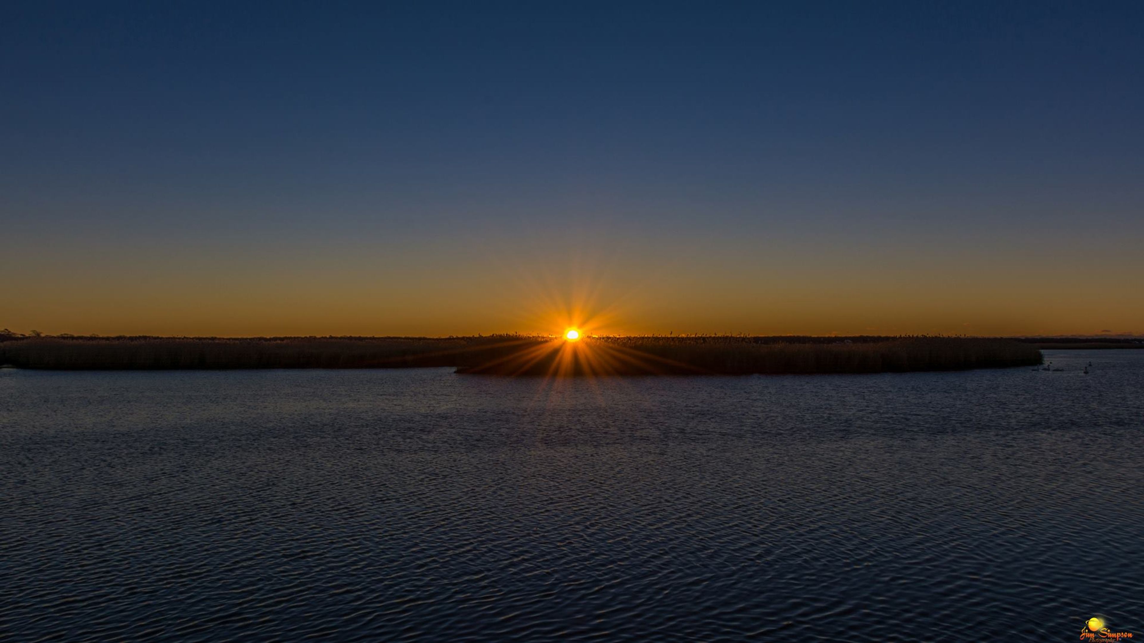 Early morning paddlers are rewarded by an amazing sunrise over Squassux Landing.