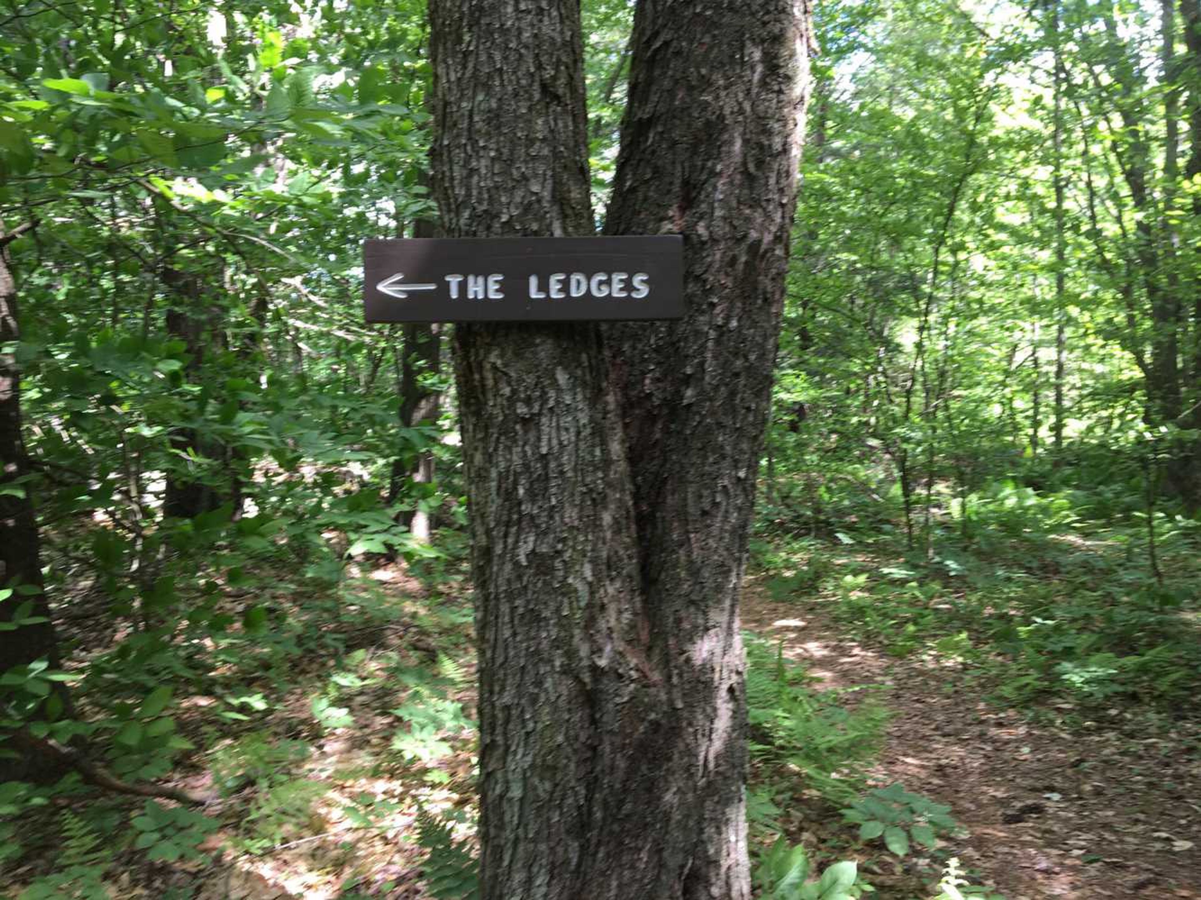 A sign points to The Ledges along the trail.