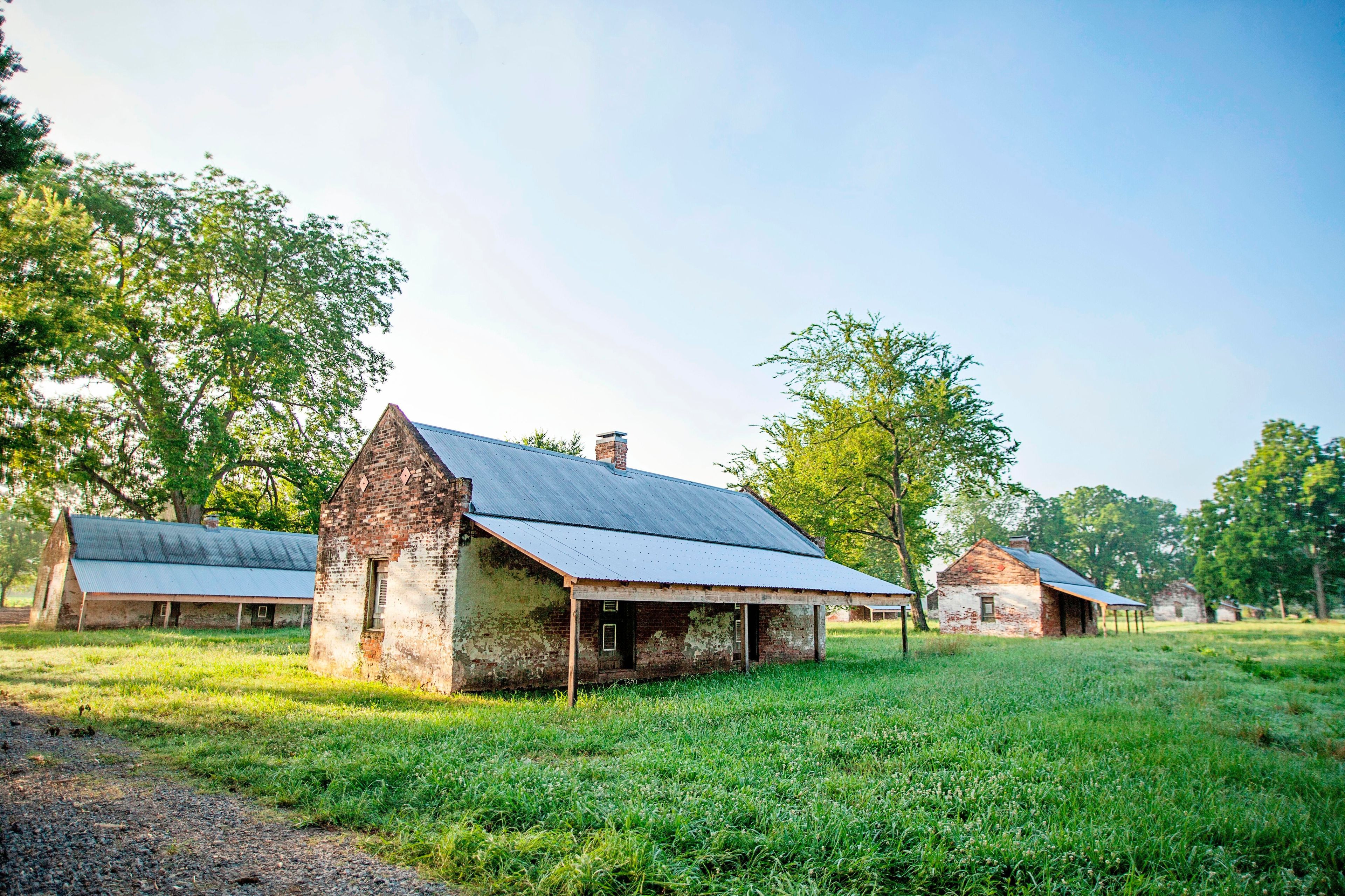 These brick cabins were built in the 1840s to house enslaved workers on Magnolia Plantation. Following Emancipation the cabins served as homes for tenant farmers.