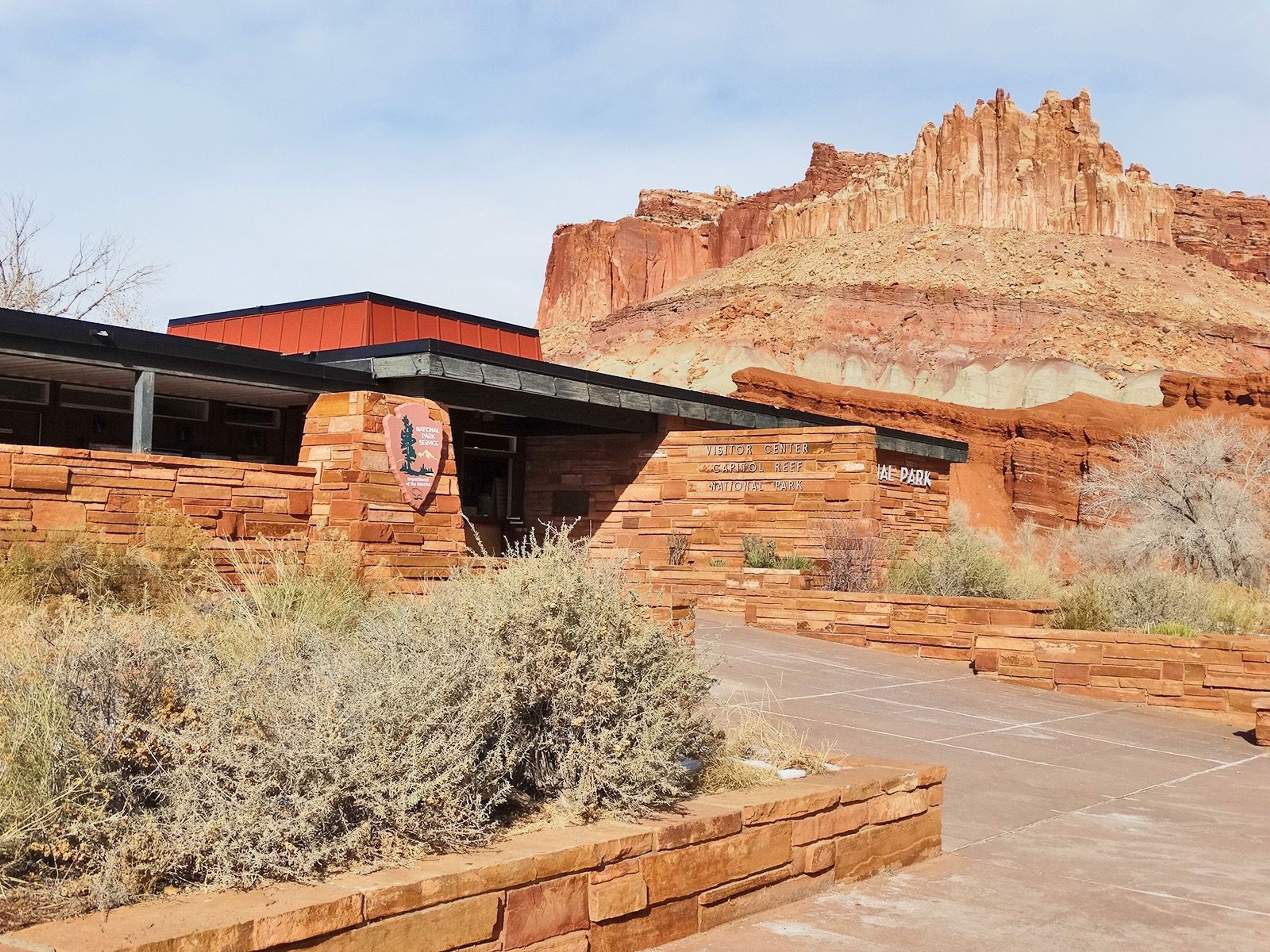 The Capitol Reef Visitor Center sits below cliffs known as "The Castle".