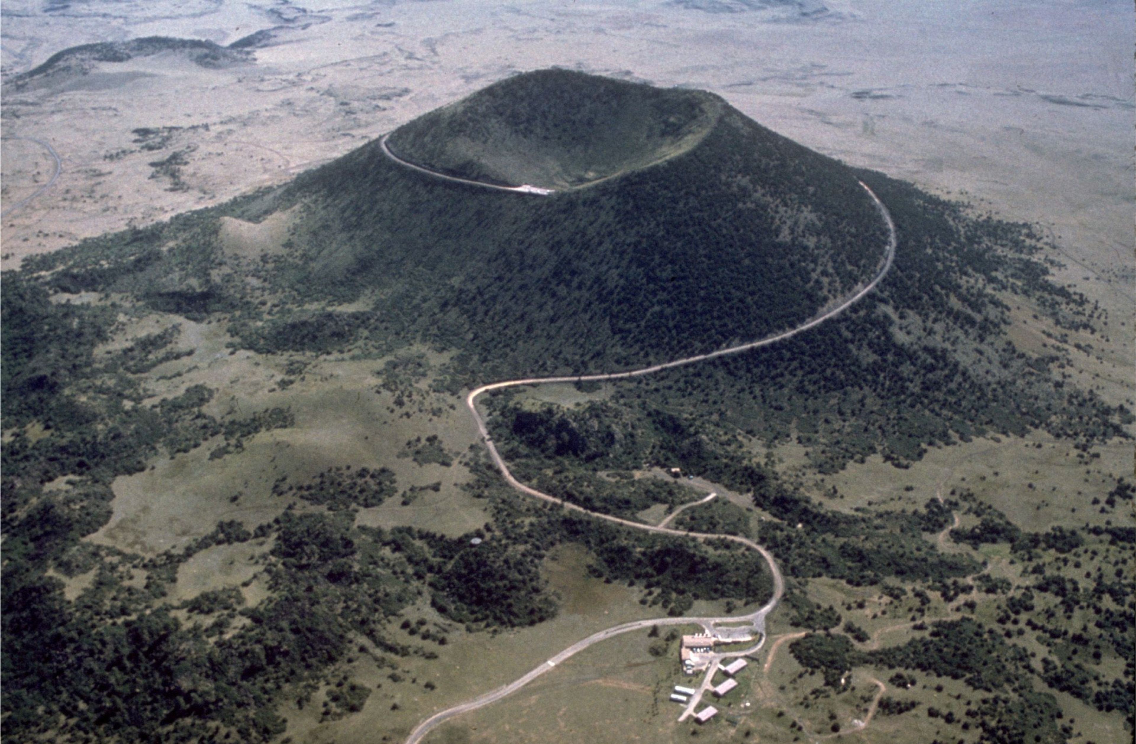 Capulin Volcano is a classic example of a cinder cone. The crater is approximately 130 m (420 ft) deep and 440 m (1,450 ft) across. The base of the mountain is 6 km (4 mi) in circumference. Volcano Road spirals up the volcano, providing panoramic views.