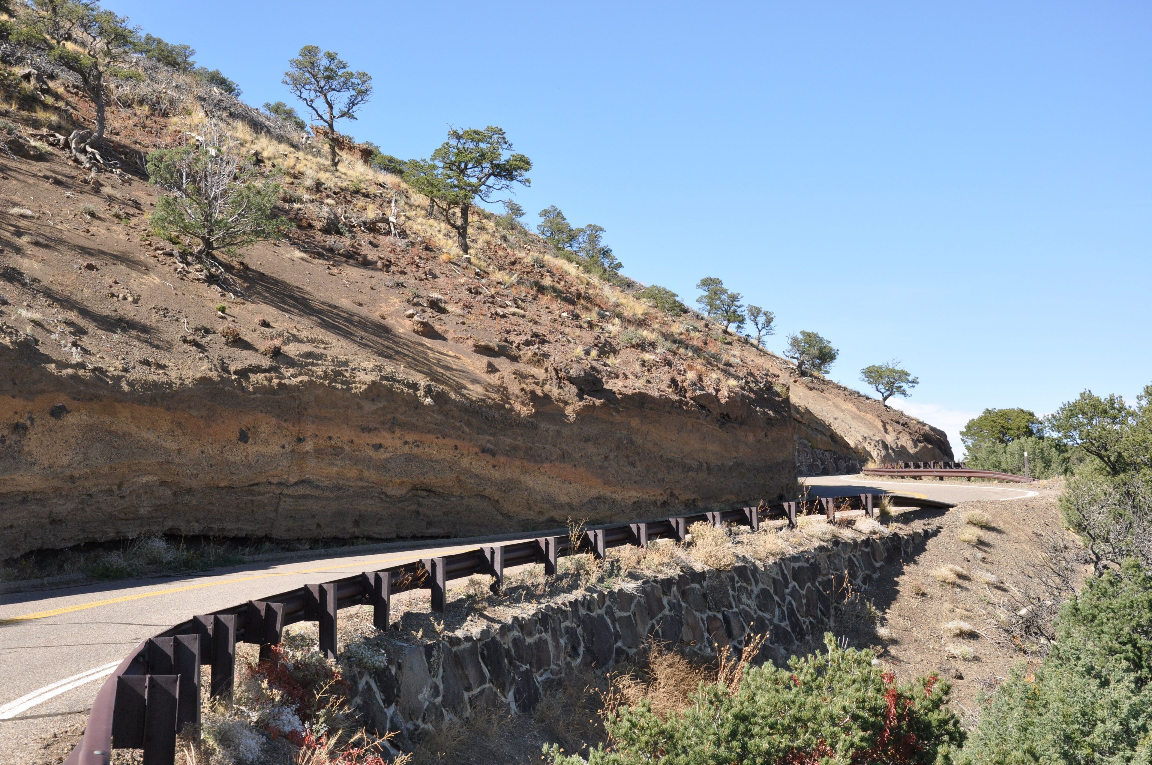 Layers of volcanic material can be seen in the Volcano Road that takes visitors to the top of Capulin Volcano.