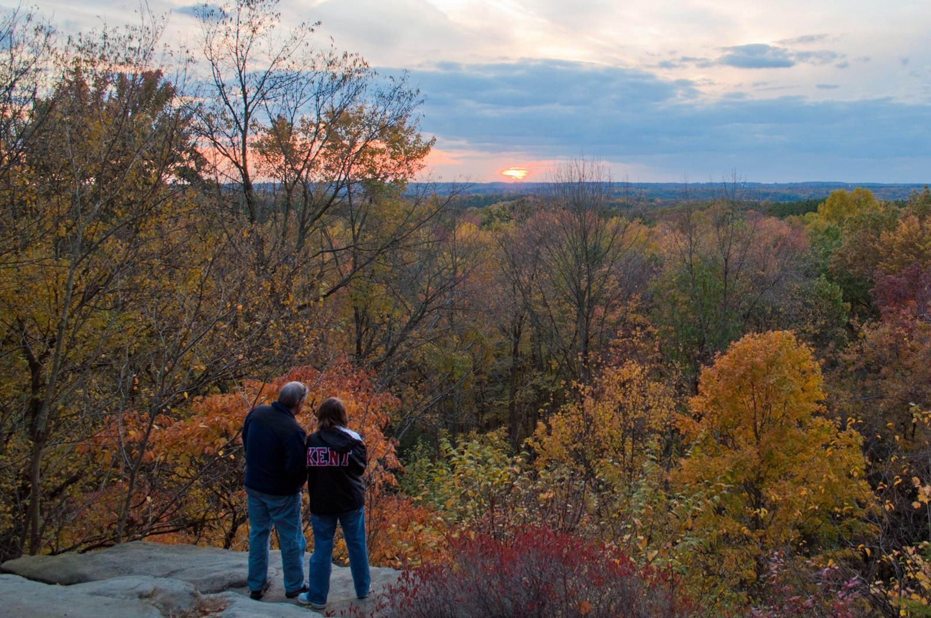 Visitors taking in the view at the Ledges Overlook in fall.