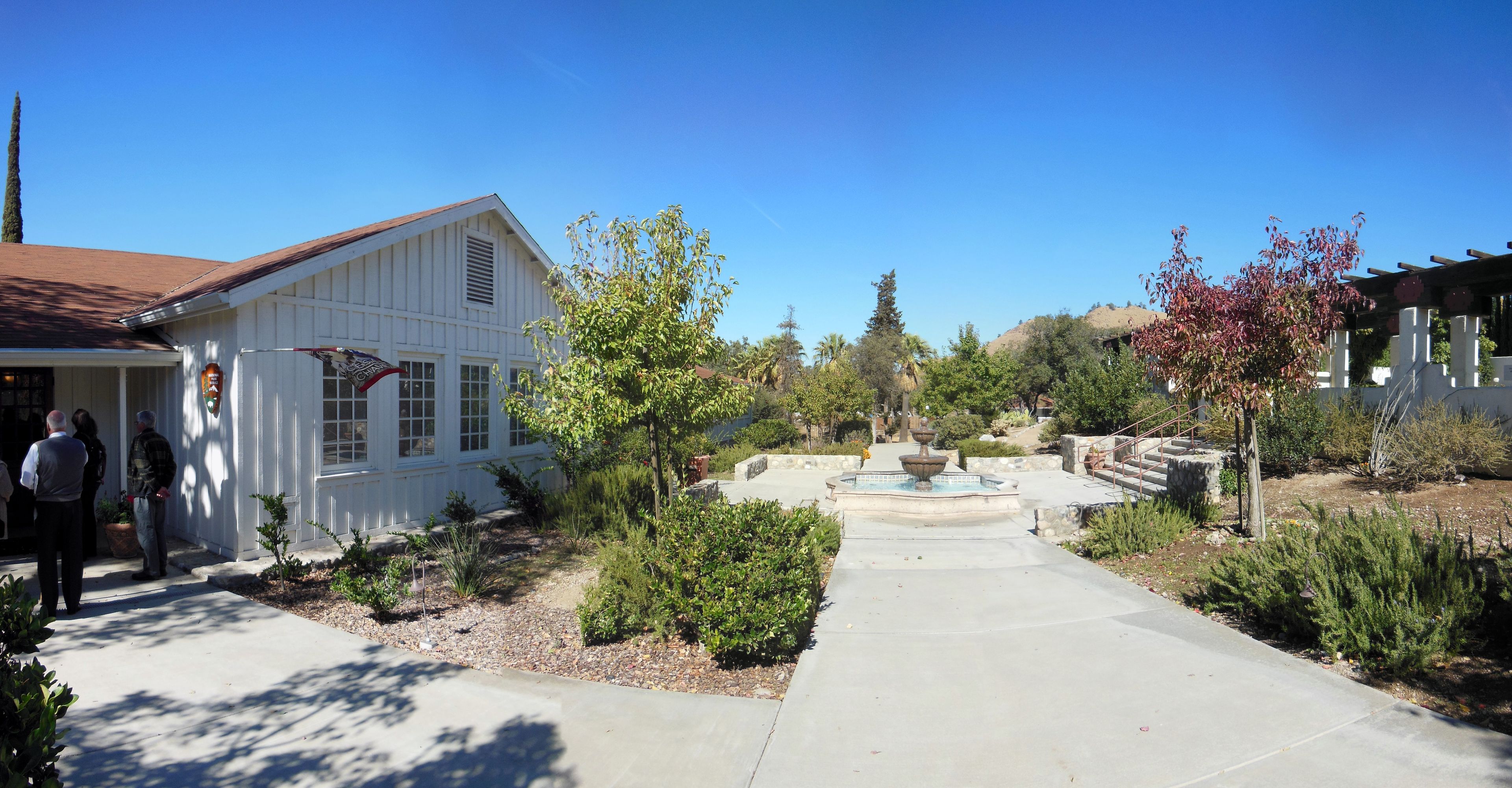 A walkway separates the entrances to the visitor center and the memorial garden.