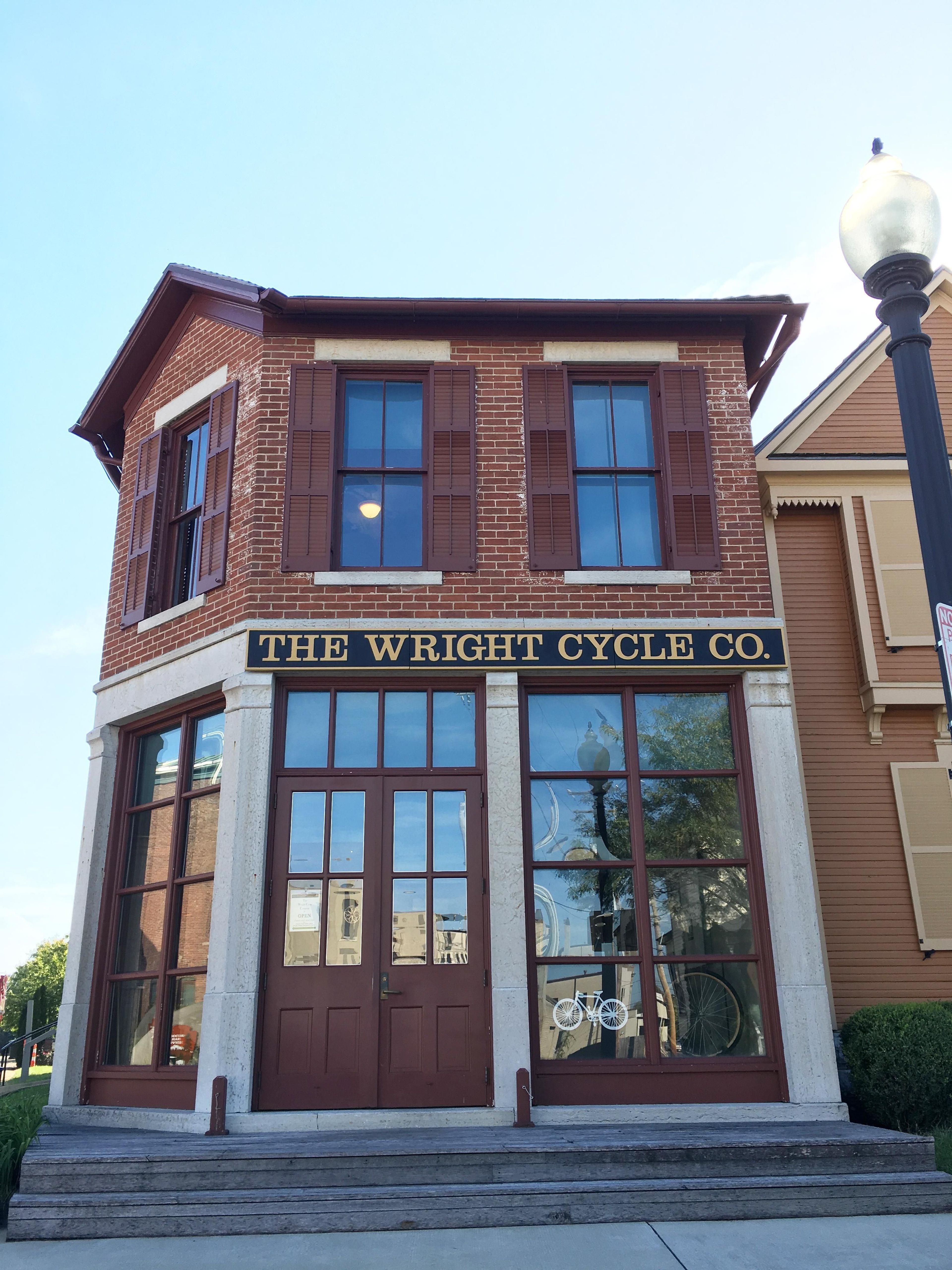 A front view of the building housing The Wright Cycle Company bike shop.