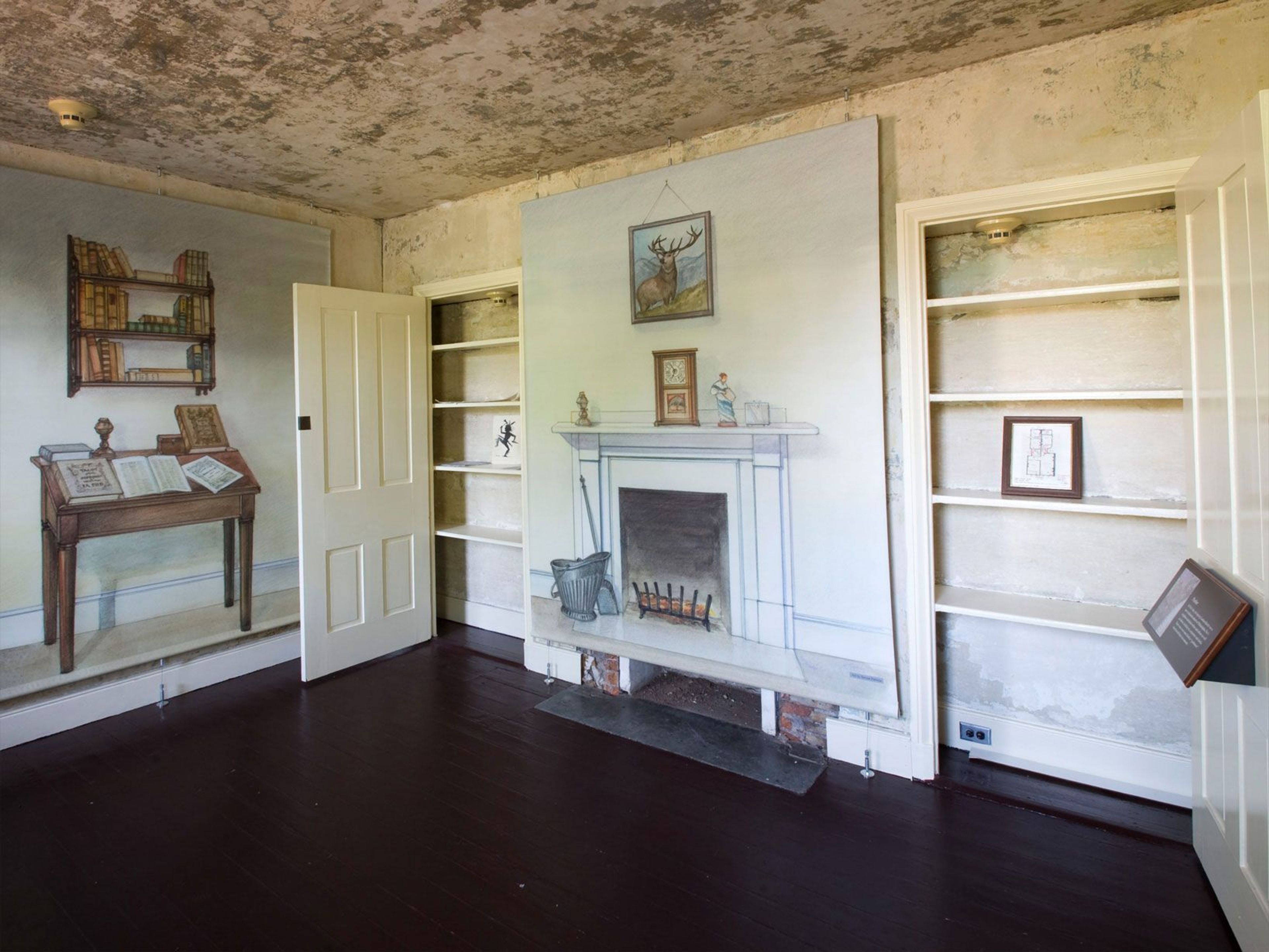 Wall mounted illustrations show how the room may have been furnished when Edgar Allan Poe lived in the house.