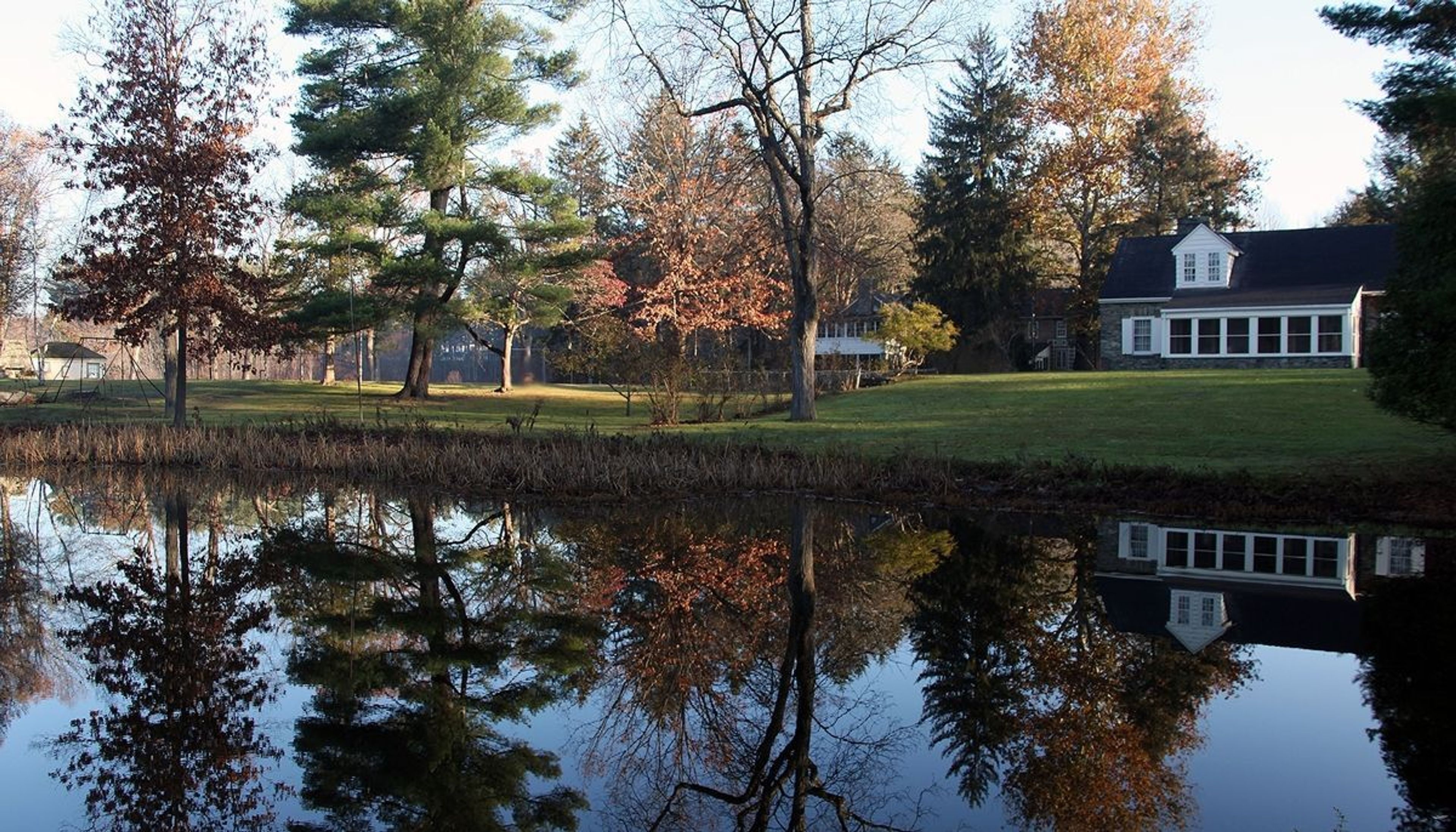 Looking across the water at the Stone Cottage and Val-Kill Cottage