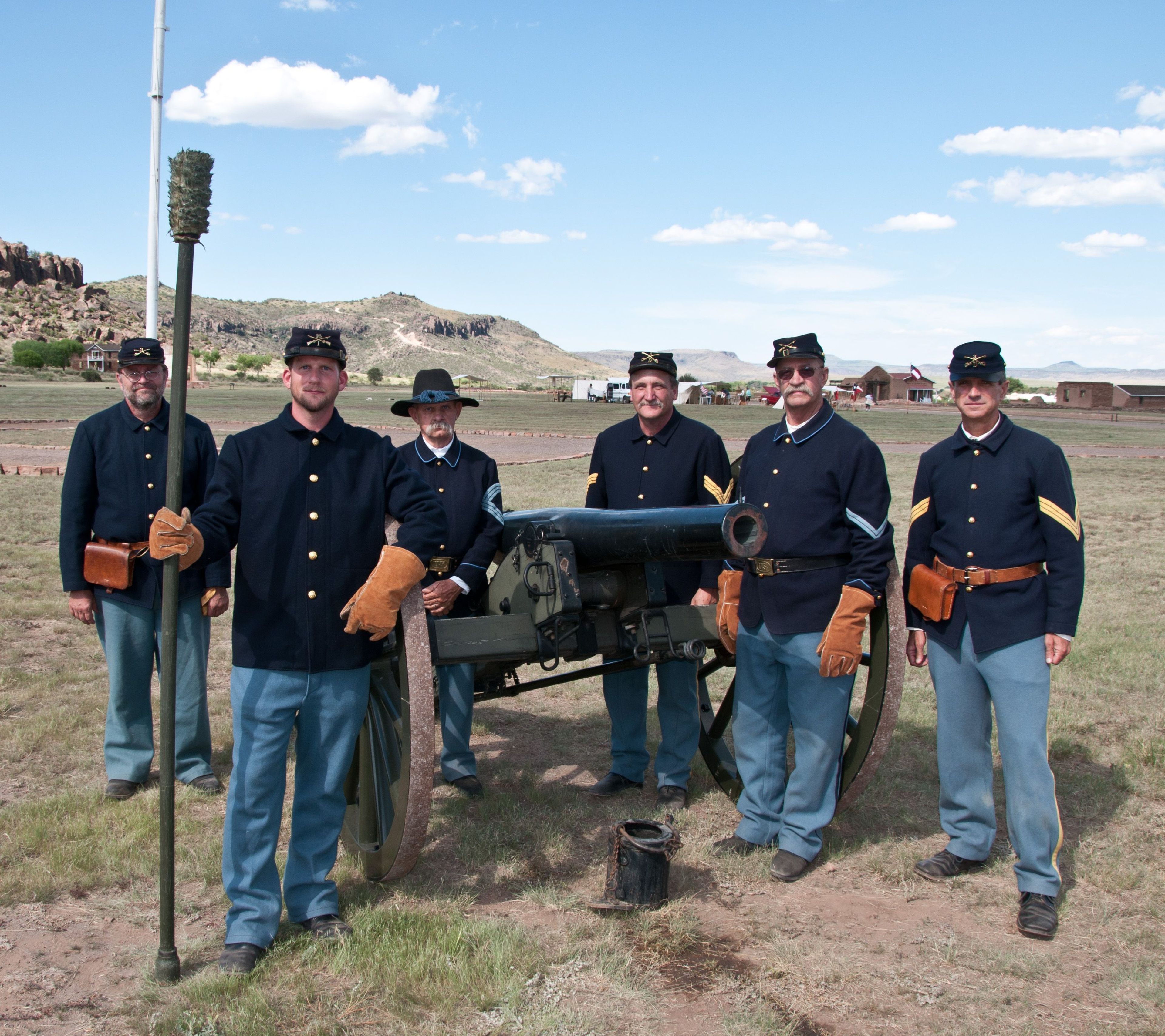 The Artillery Crew stand ready for orders to post at their positions and fire the U.S. 3-inch Ordnance Rifle.