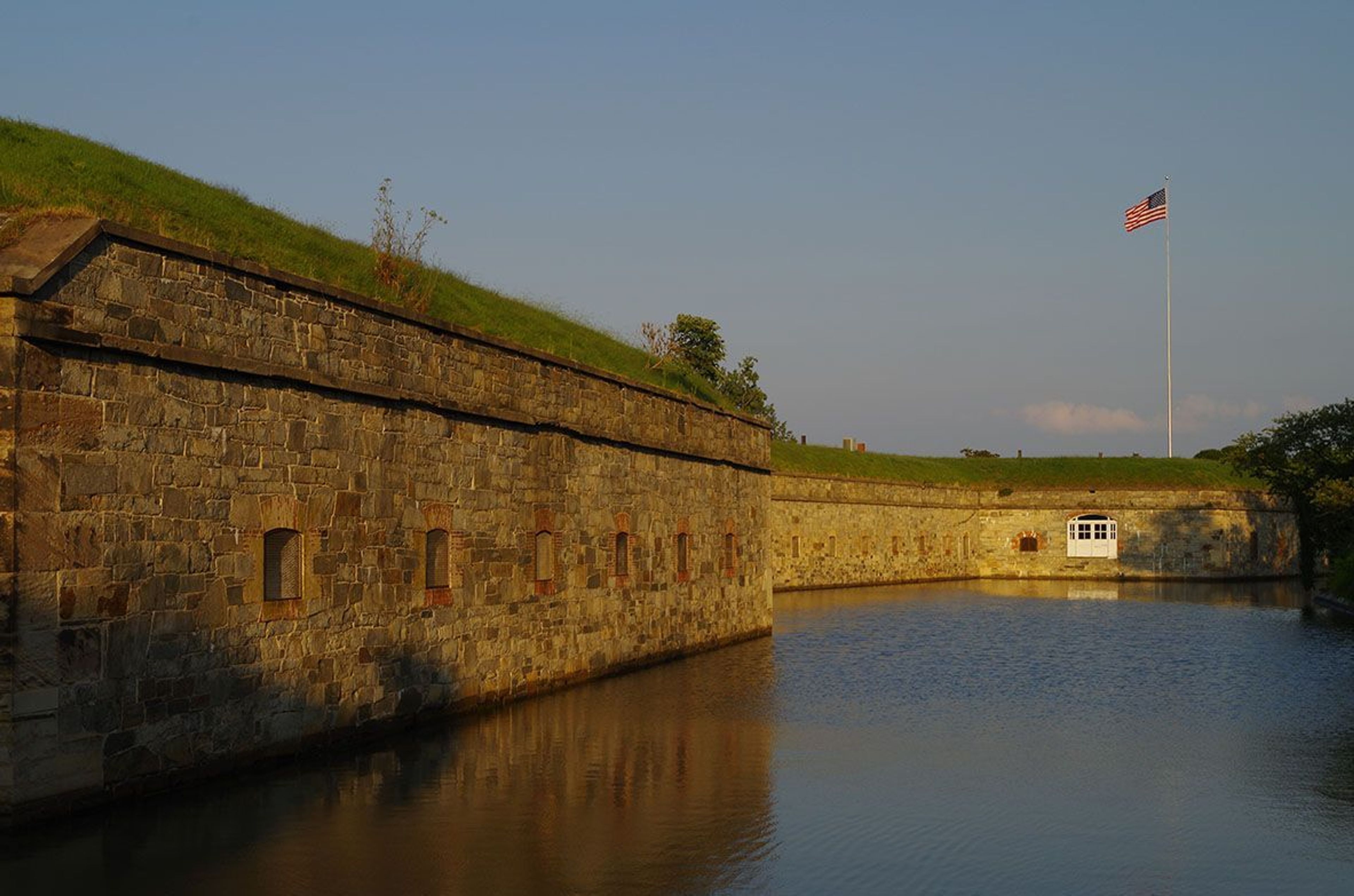 Brilliant colors of the setting sun offer unique views of the largest stone fortification ever built in the United States.