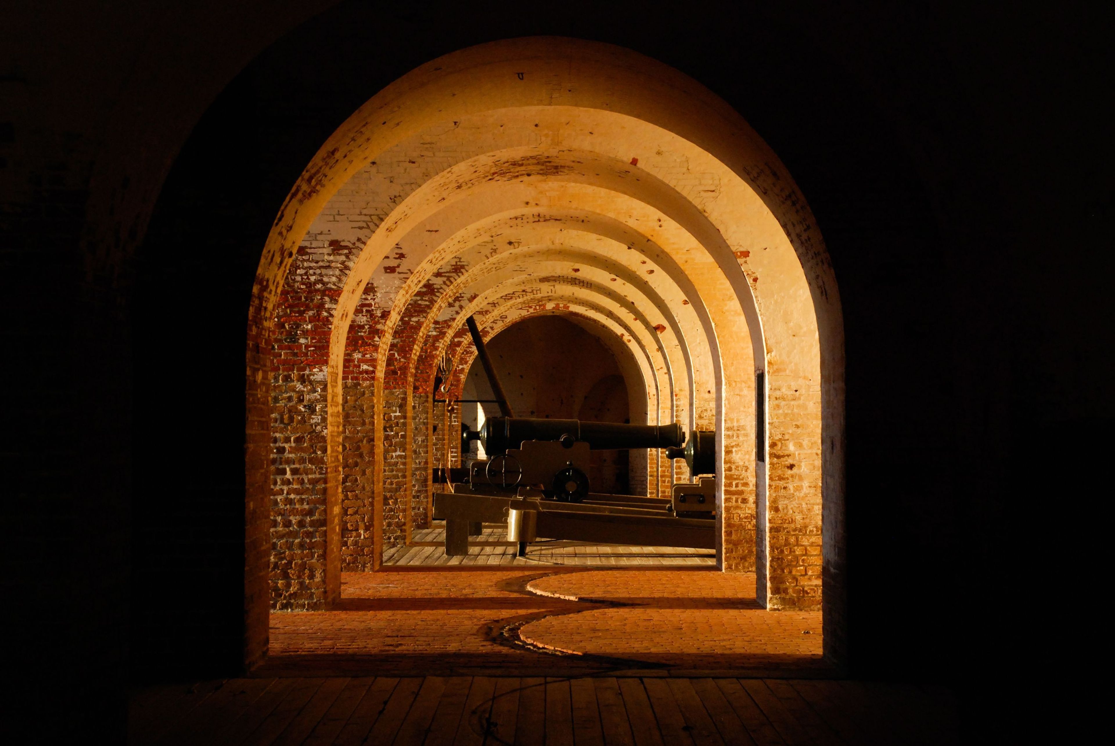 Fort Pulaski shows off its classic arched architecture and cannon.