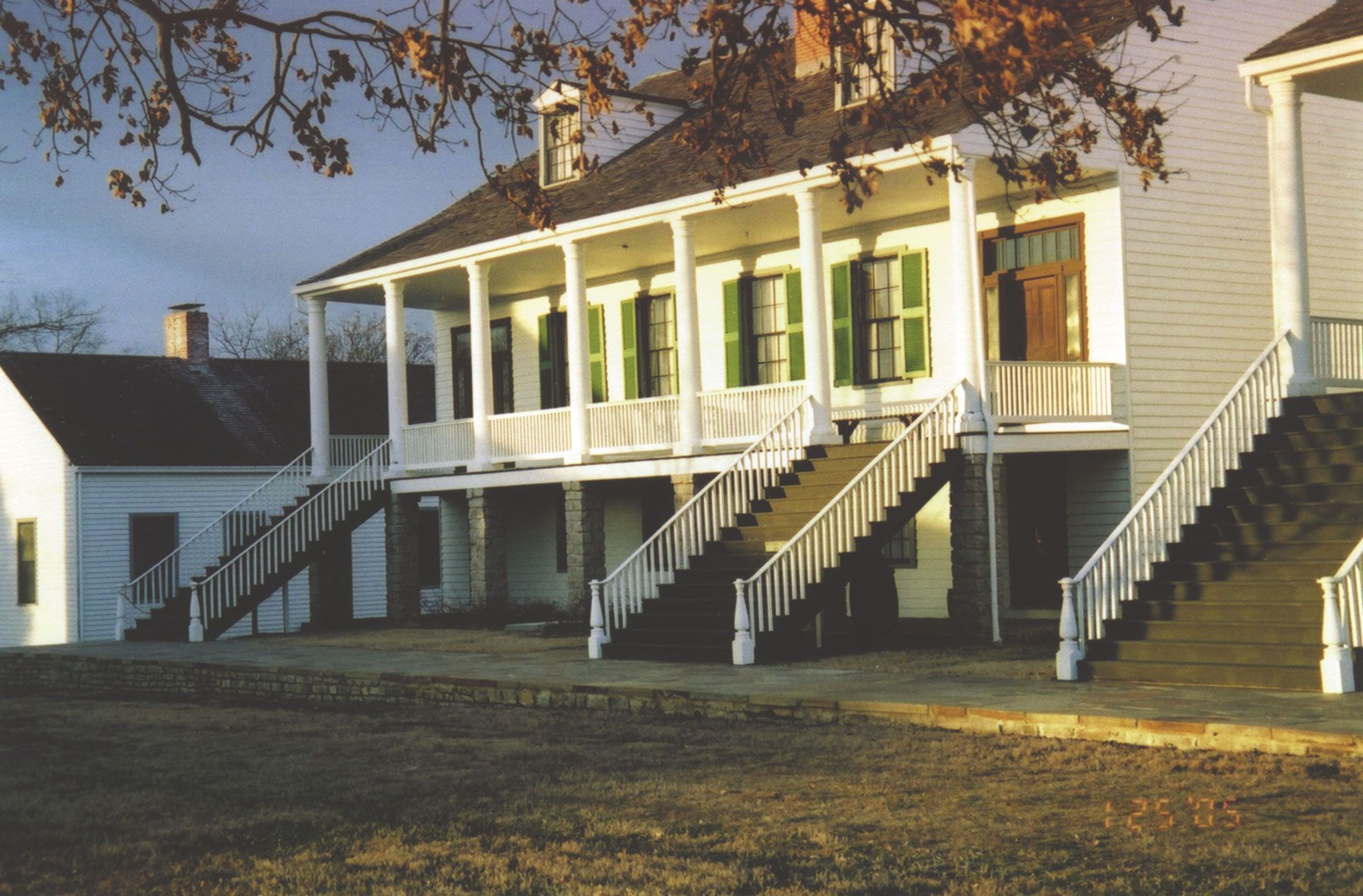 Officers quarters at Fort Scott bathed in the light of the afternoon sun.