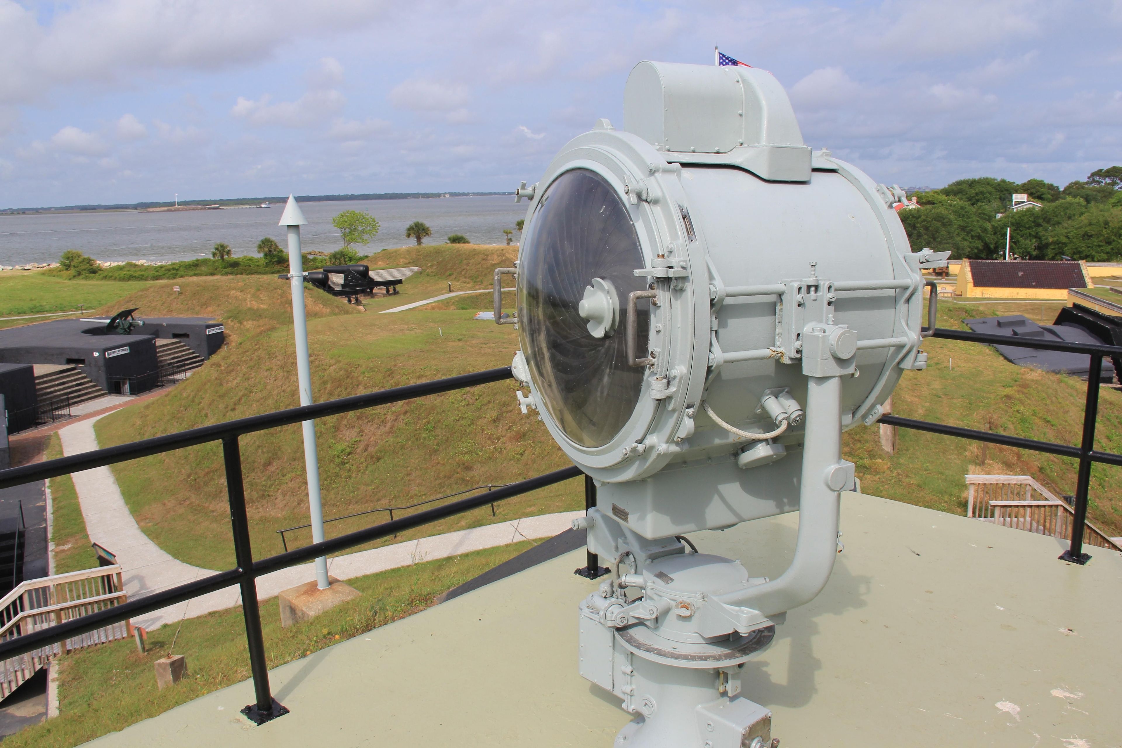 Interior View of Fort Moultrie featuring the World War II signal light with grass hills and black concrete gun bateries