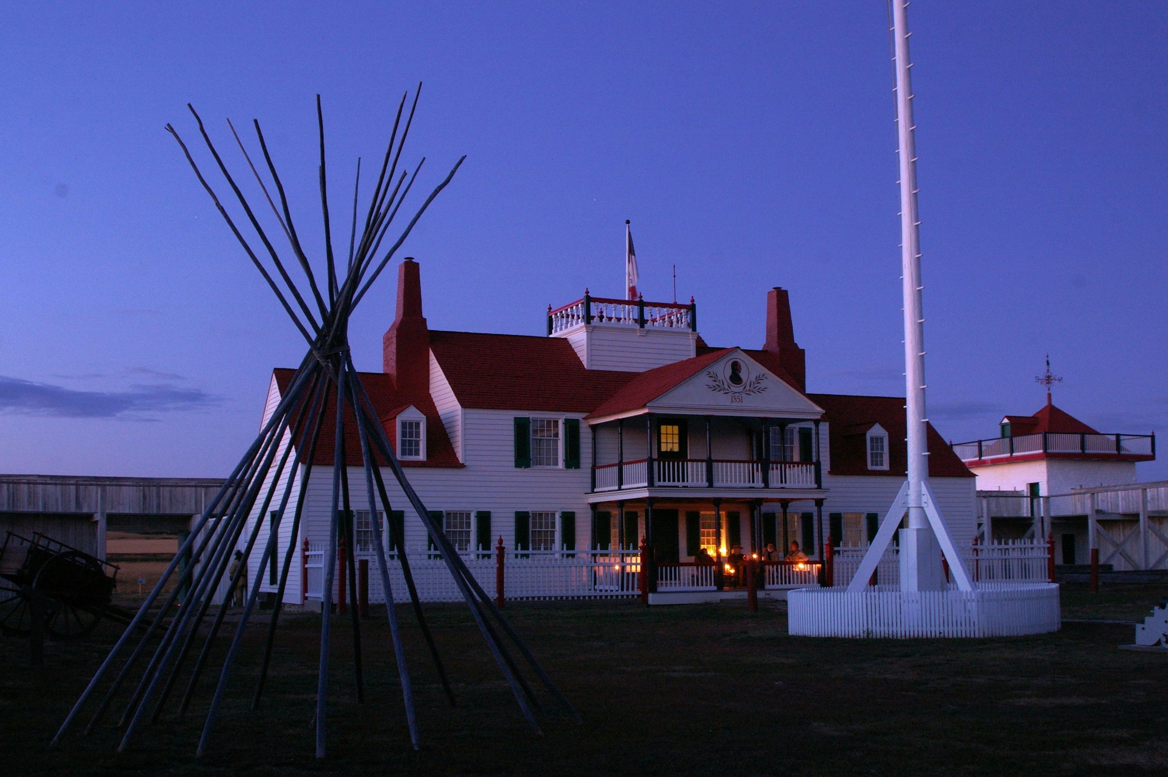 Volunteer reenactors relax on the Bourgeois House porch