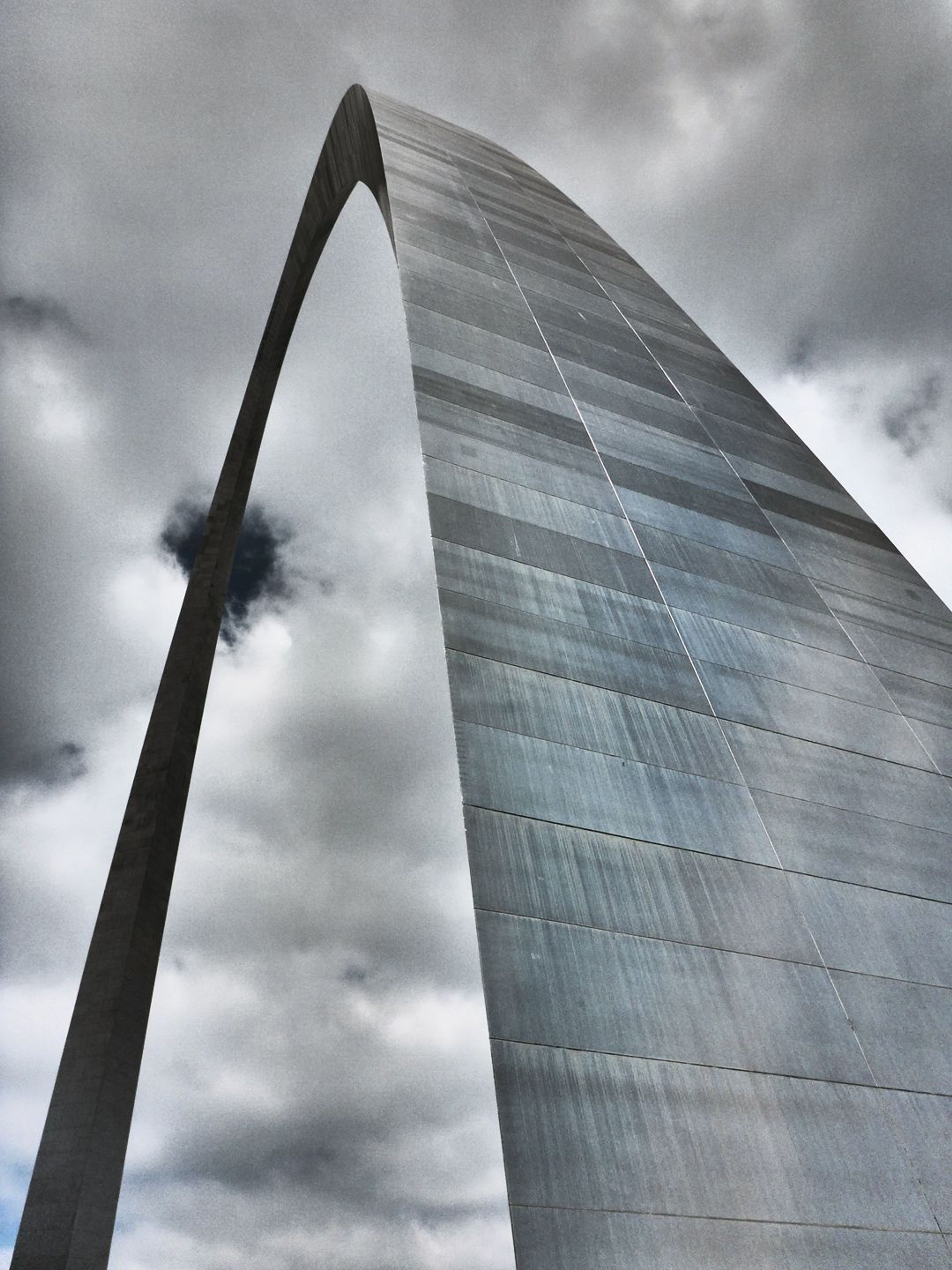 Arch reaching toward the clouds.