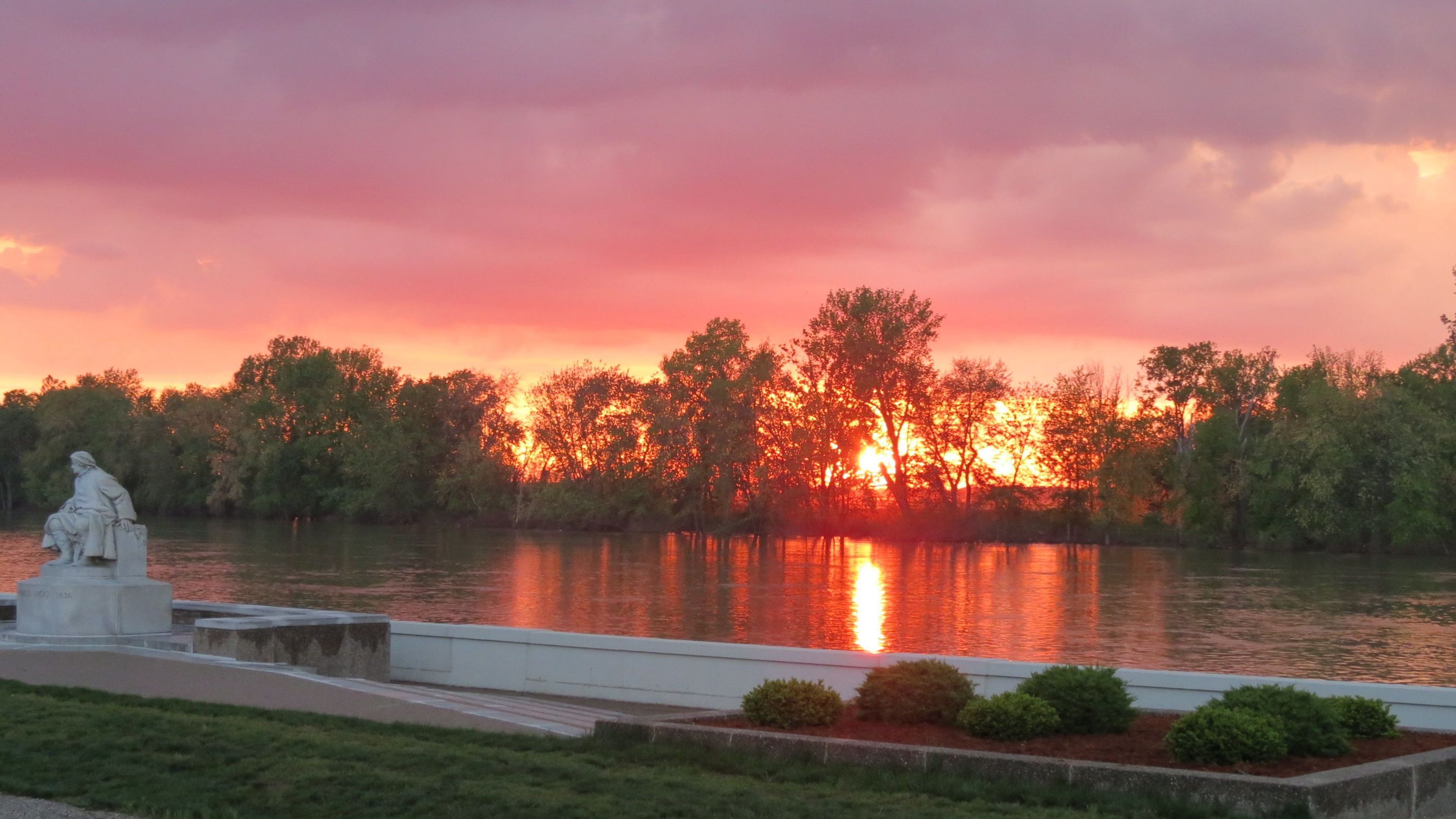 At the end of each day, visitors gather in the shadow of Vigo to watch the sun set over the Wabash River