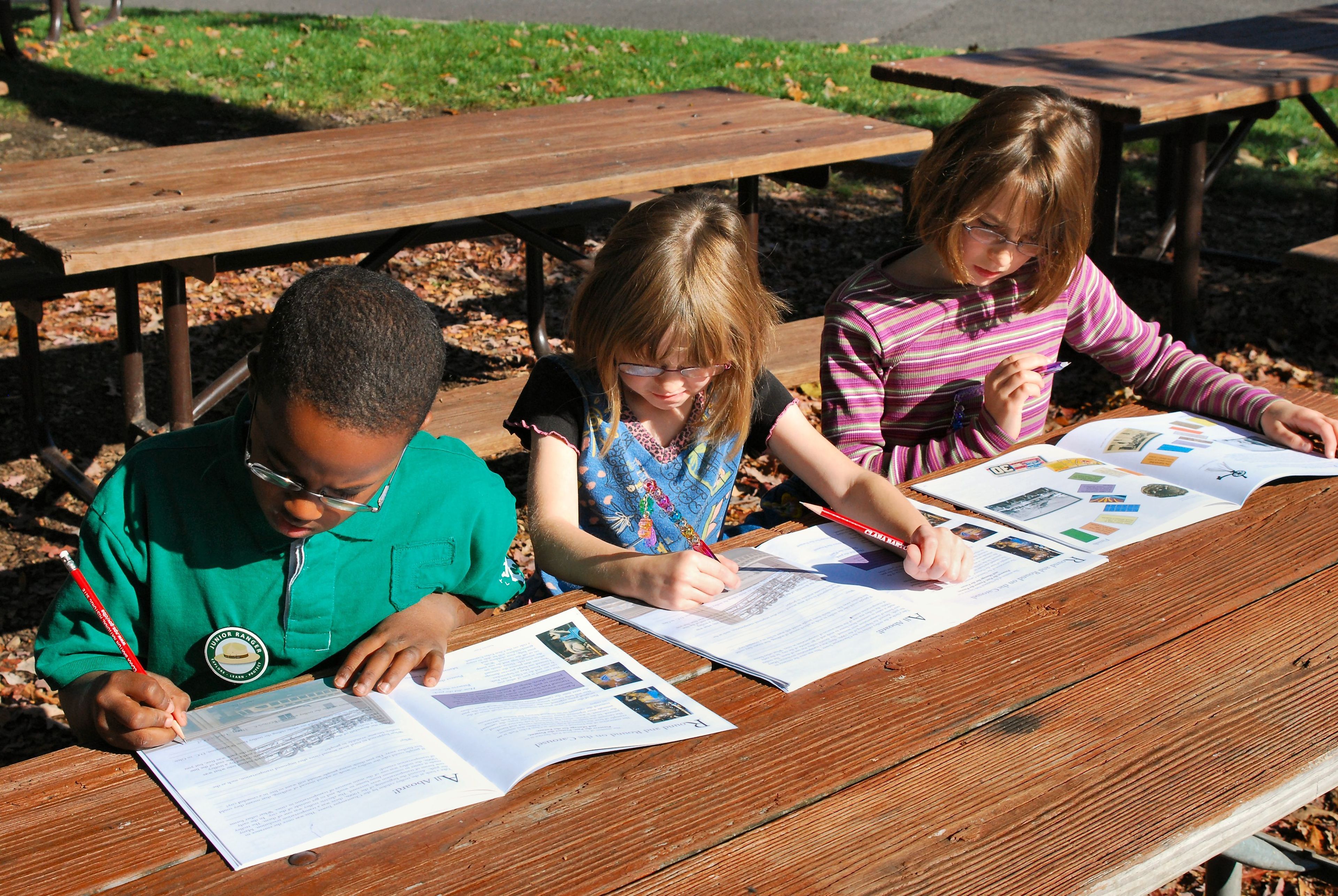 Completing the Glen Echo Park Junior Ranger Booklet to earn the Junior Ranger Badge.