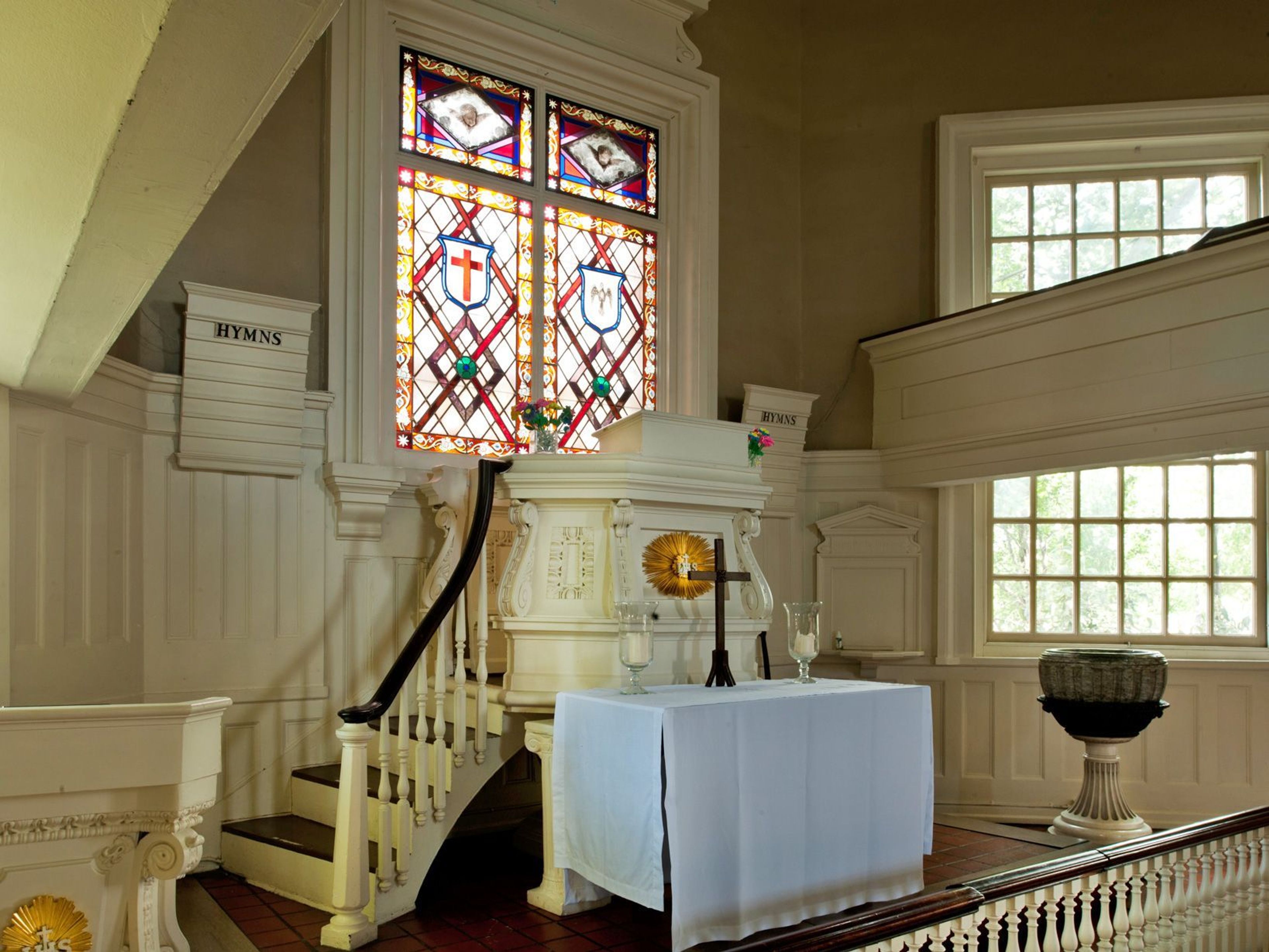 Situated above the pulpit is the only stained glass window in the church building.  Created in the mid 1800s, the window is the earliest example of American stained glass among the 3600 windows in the Philadelphia region.