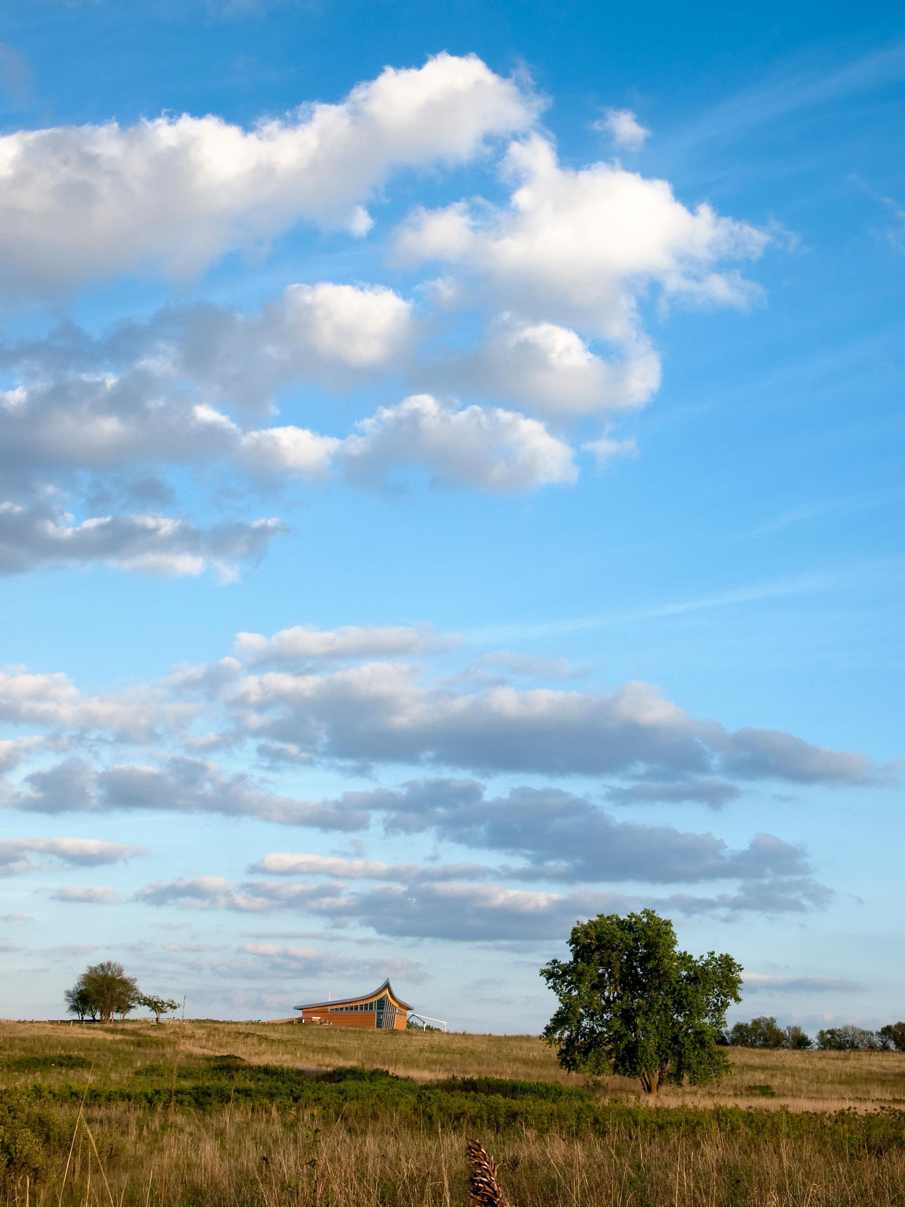 The oldest restored tallgrass prairie in the NPS spans to the Heritage Center.