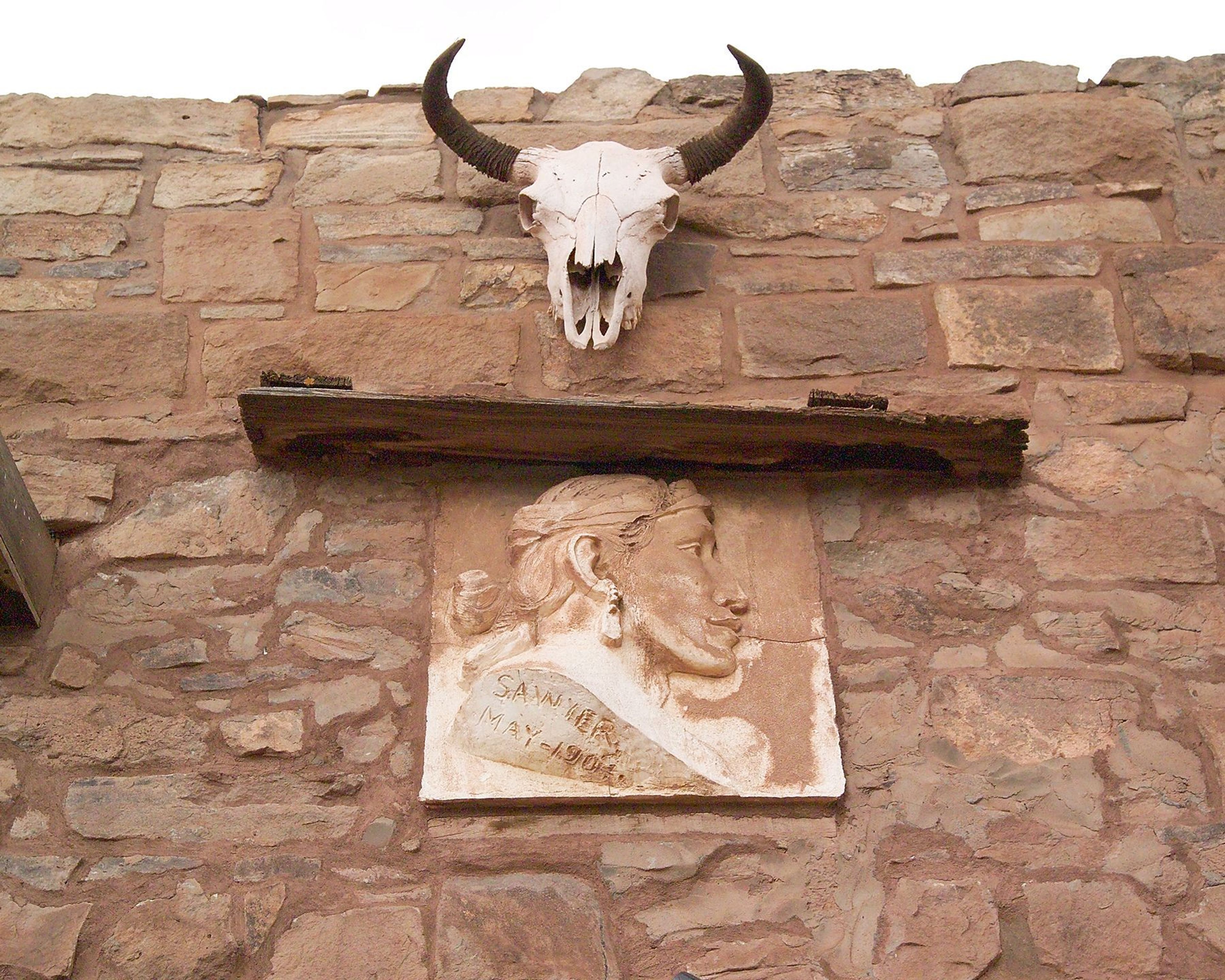 Above the entry way into the trading post, there is a sun-bleached steer skull.