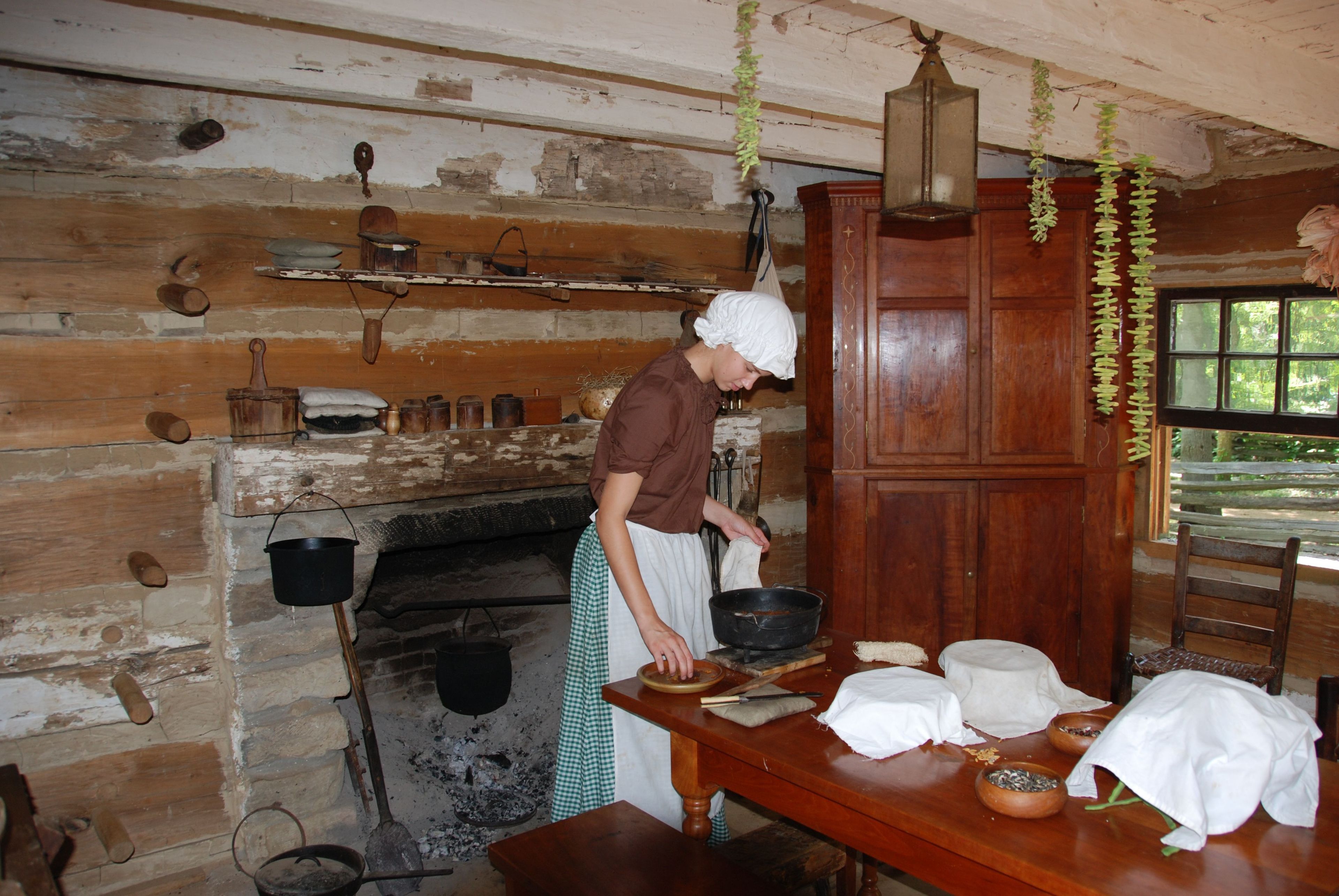 Park rangers depict pioneer life in the 1820s.