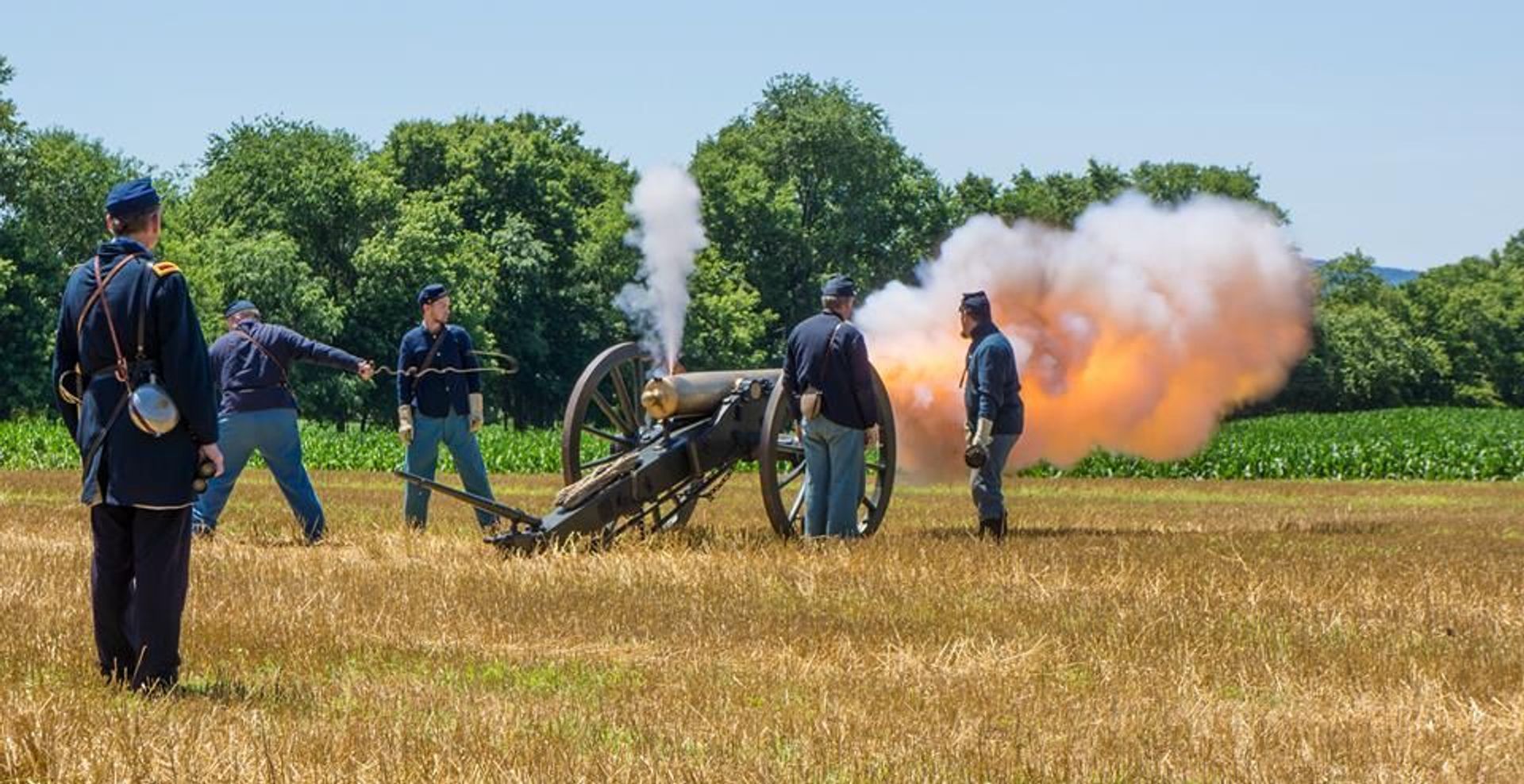 Union soldiers fire an artillery piece in commemoration of the battle.