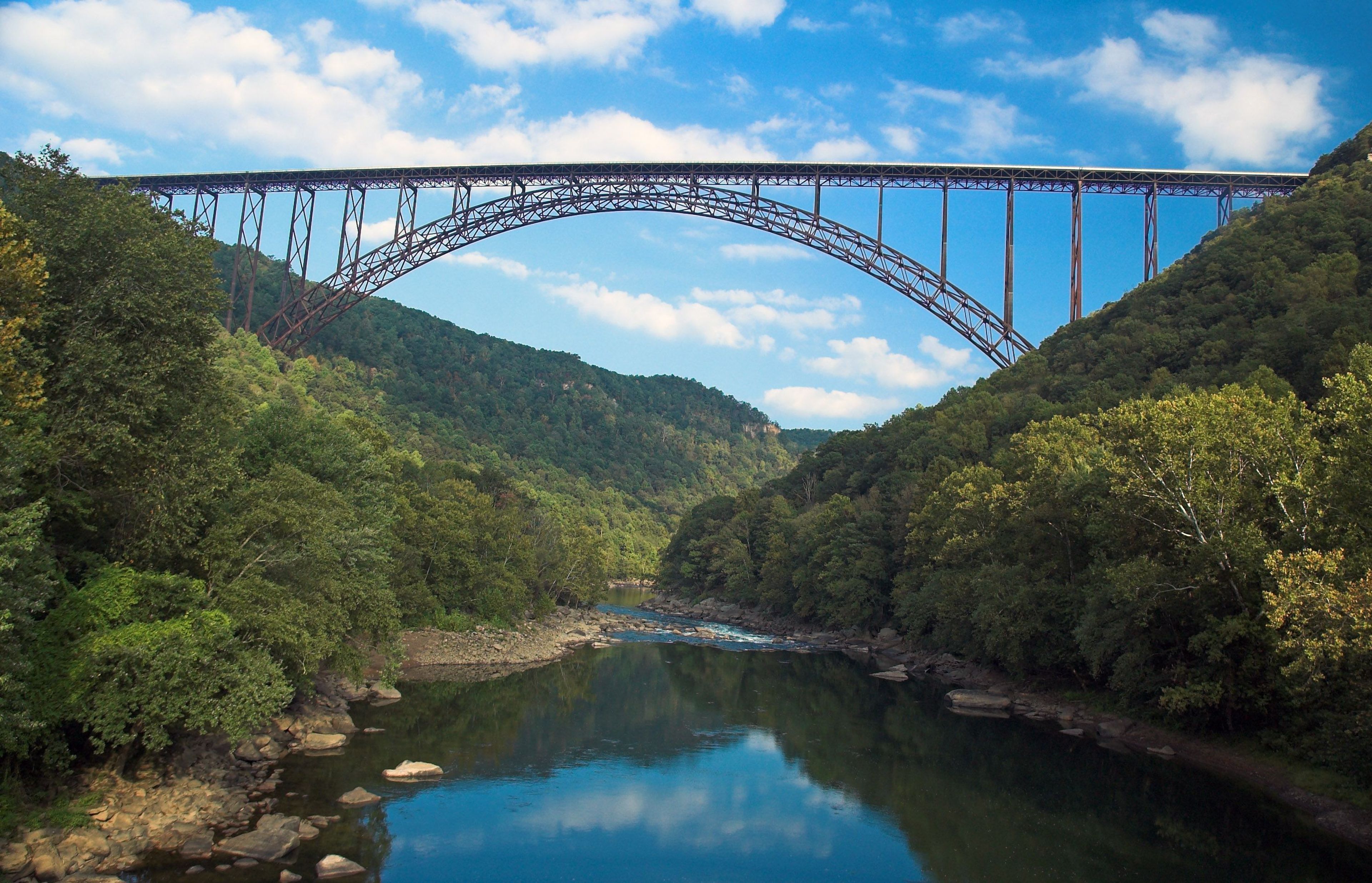 The New River Gorge Bridge spans across the New River.