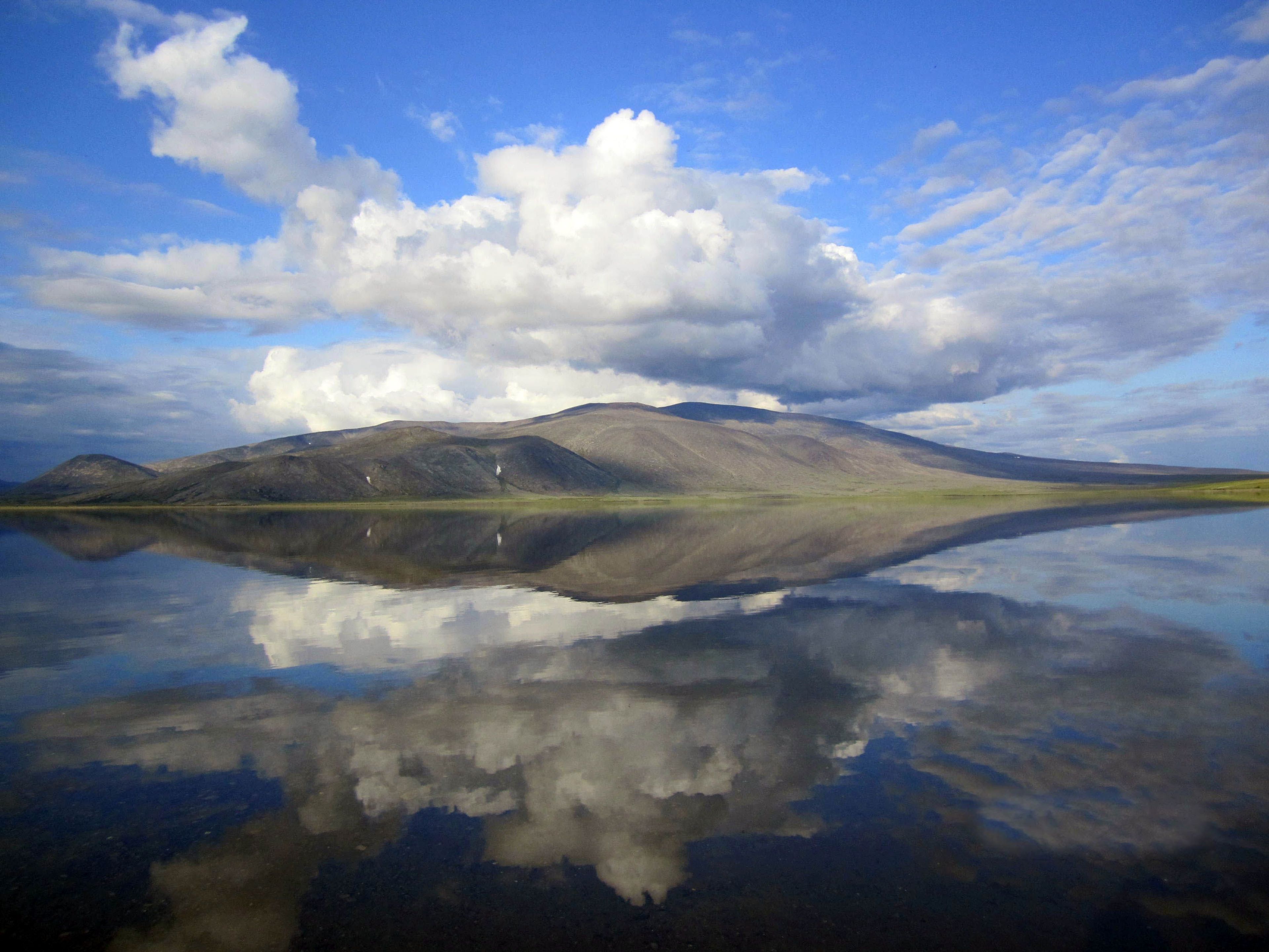 The Delong Mountains are flawlessly reflected in the clear, clean water of Desperation Lake in the northern part of Noatak National Preserve.