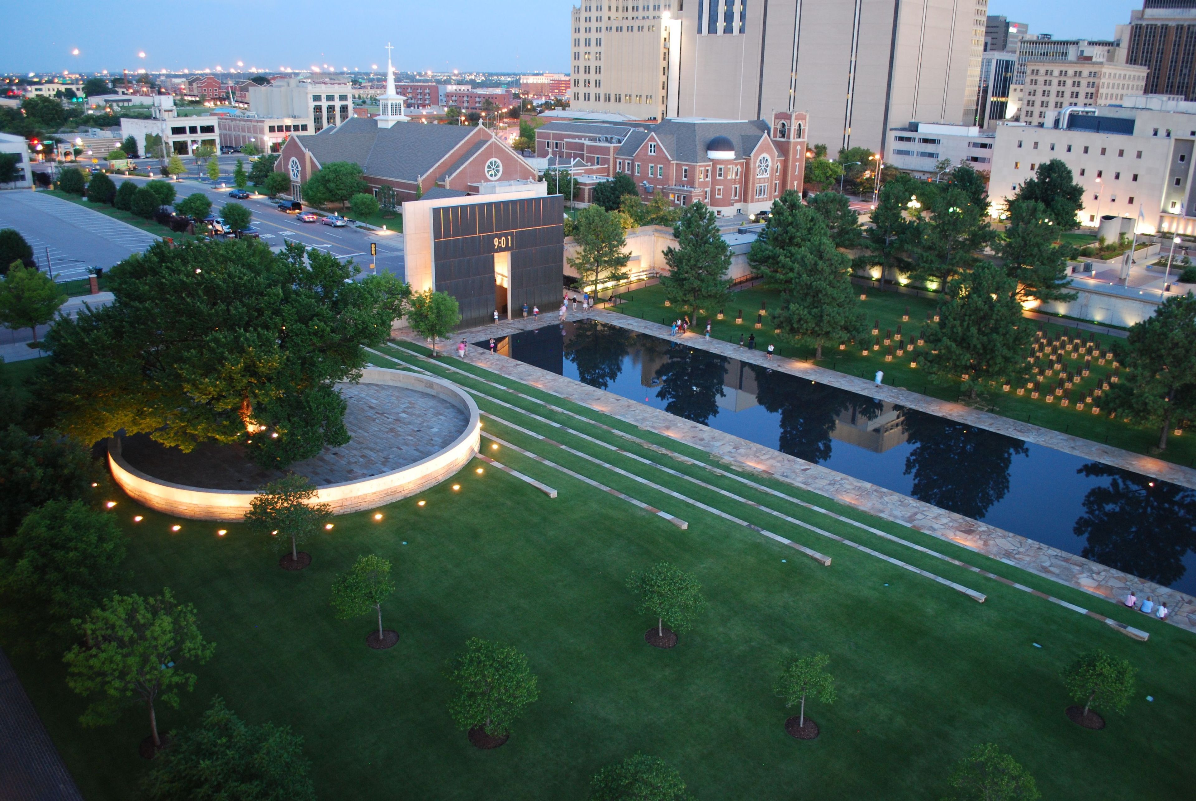 Beat the summer heat, on an evening stroll through the illuminated Field of Empty Chairs, the Gates of Time, and the Survivor Tree. All walkways are brightened to allow enjoyment of this peaceful time of day.