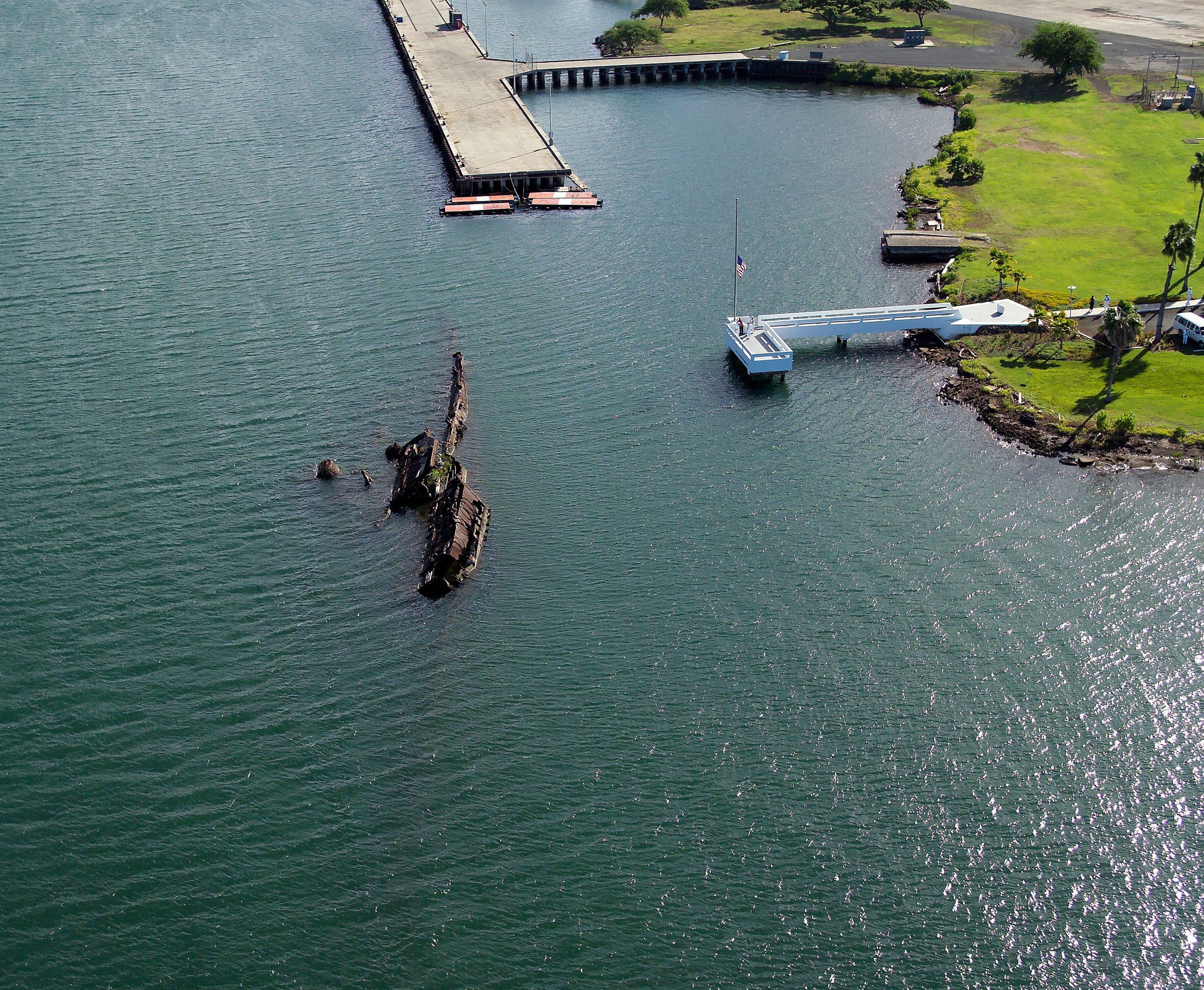 The USS Utah lays where she fell on the north side of Ford Island. This decision was made in 1944 after several attempts at raising the ship failed. The quiet decision was made to leave the bodies of 58 crewmen onboard, considering them buried at sea.