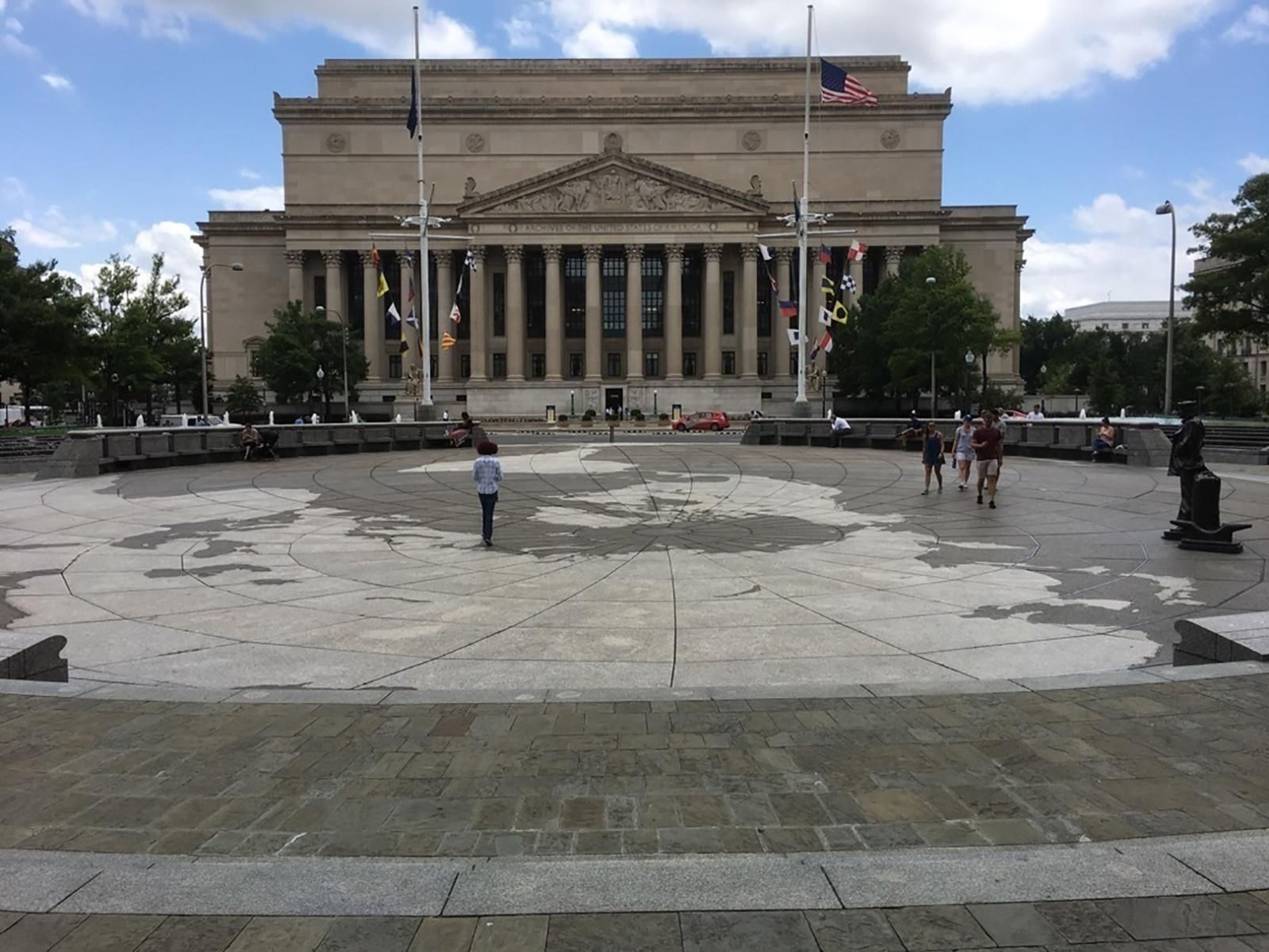 Explore the plaza, fountains, and artwork of the US Navy Memorial.