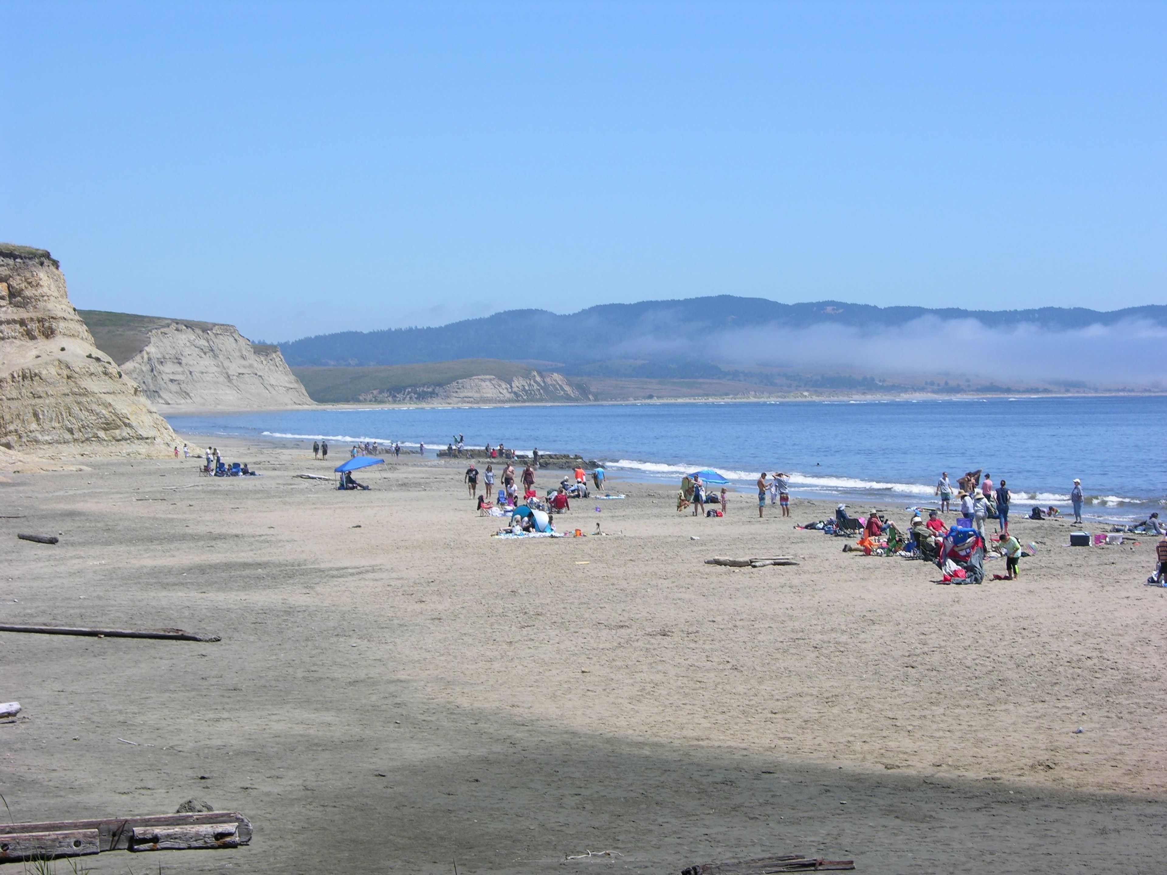 Visitors enjoy a sunny day at Drakes Beach.