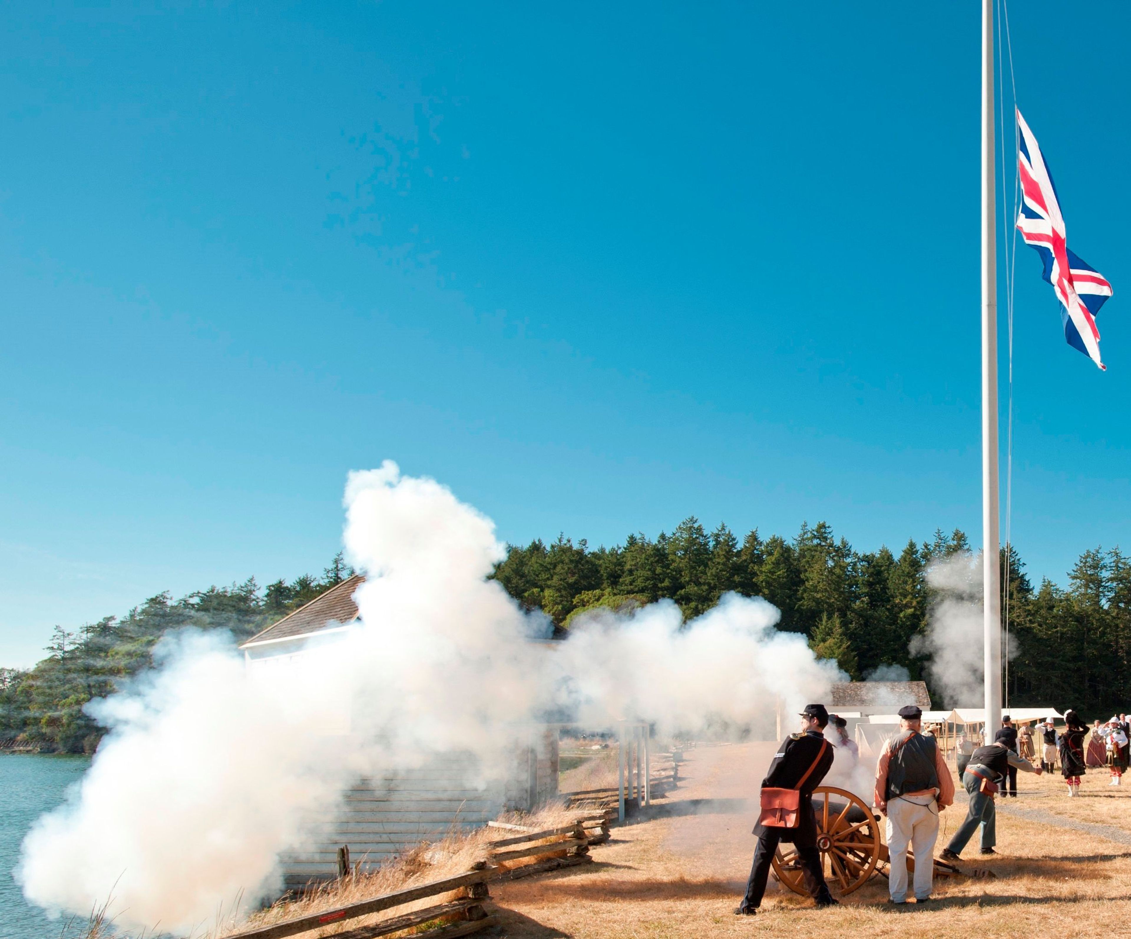 Reenactors fire a cannon at Encampment