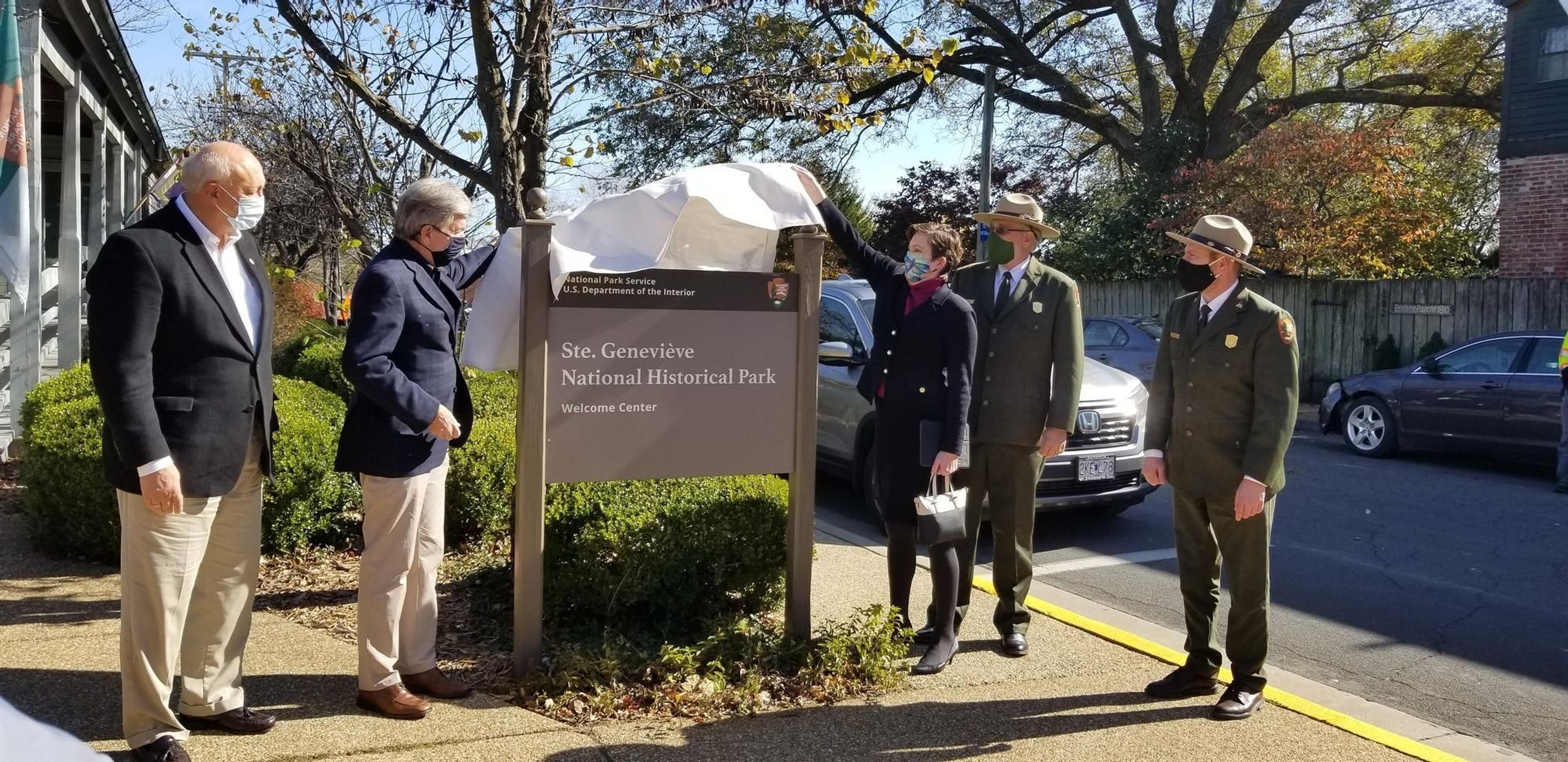 A new welcome sign is unveiled at the Visitor Center during the Ste. Geneviève National Historical Park Dedication Ceremony on November 2, 2020.