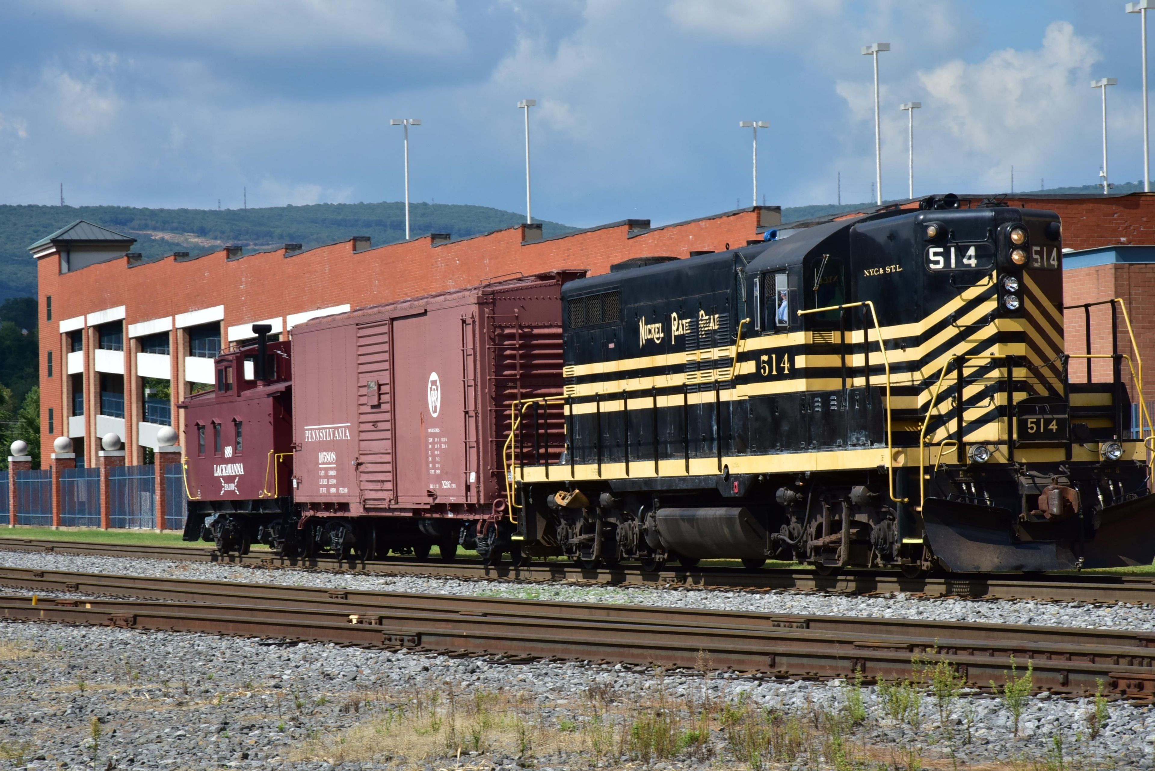 Nickel Plate Road No. 514 can often be seen moving cars around in the rail yard at Steamtown National Historic Site.  Here, it can be seen pulling a Box Car and Caboose.