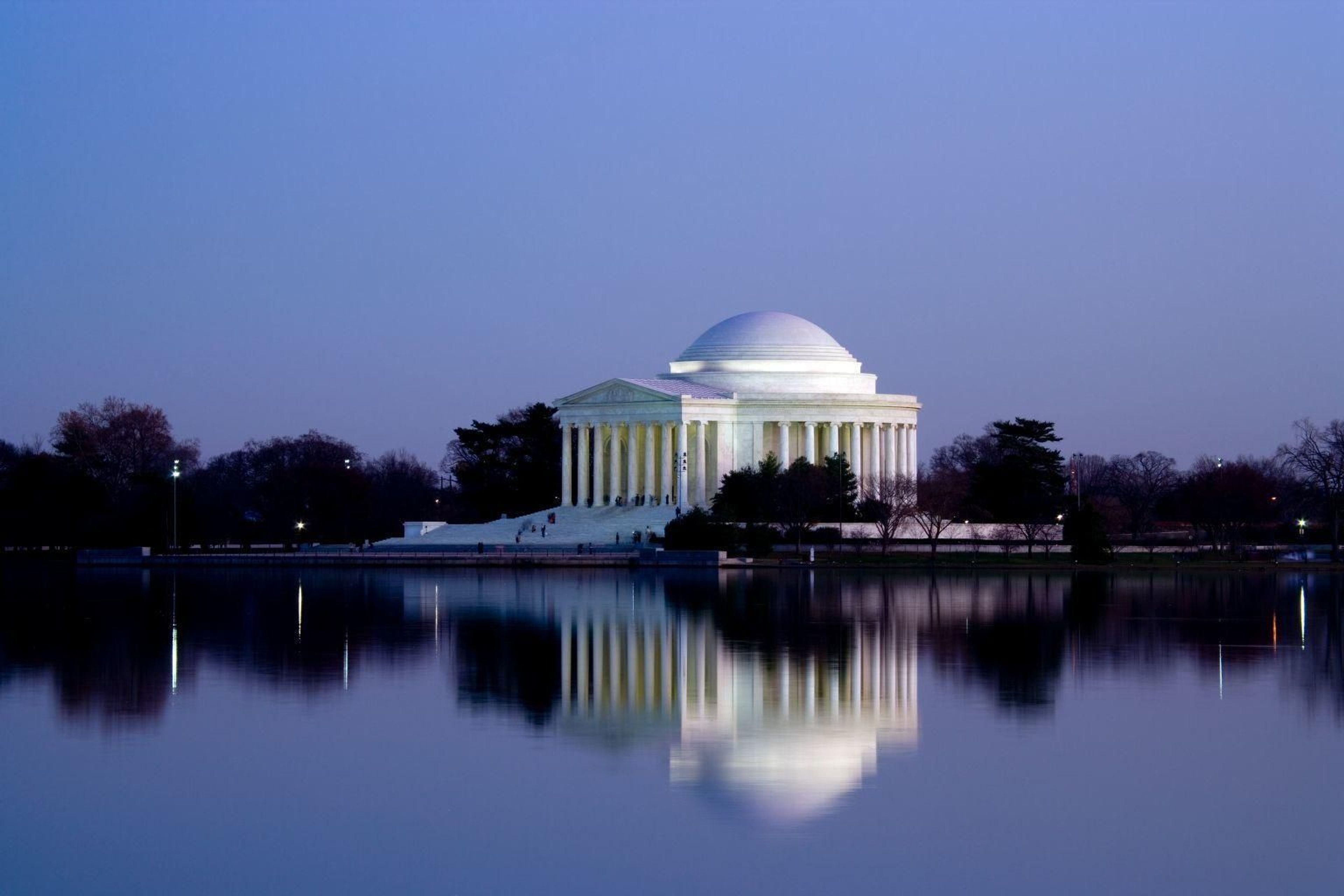 Thomas Jefferson Memorial reflecting on the Tidal Basin during sunset