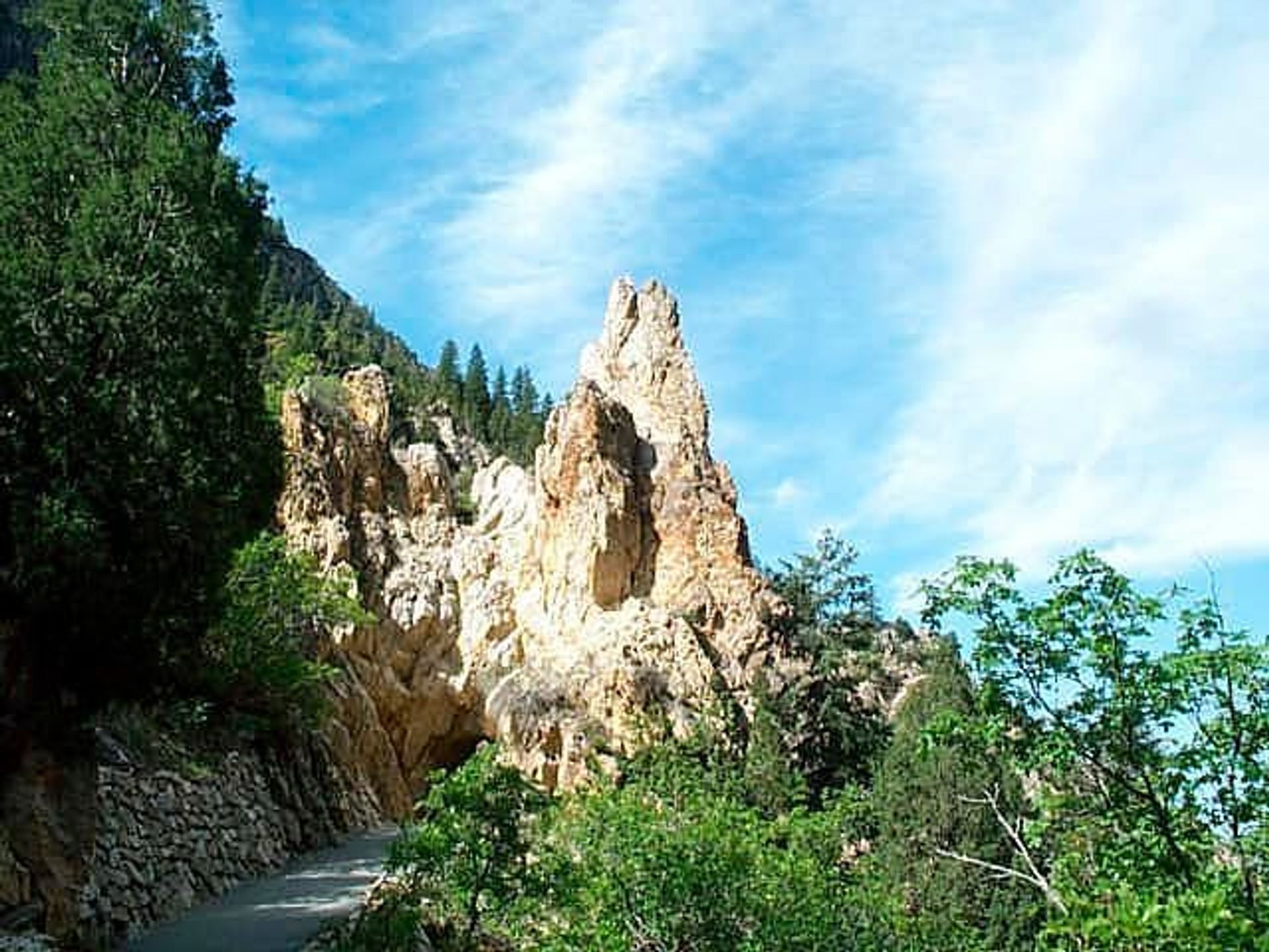 The trail to the cave leads the hiker past layer after layer of geologic time