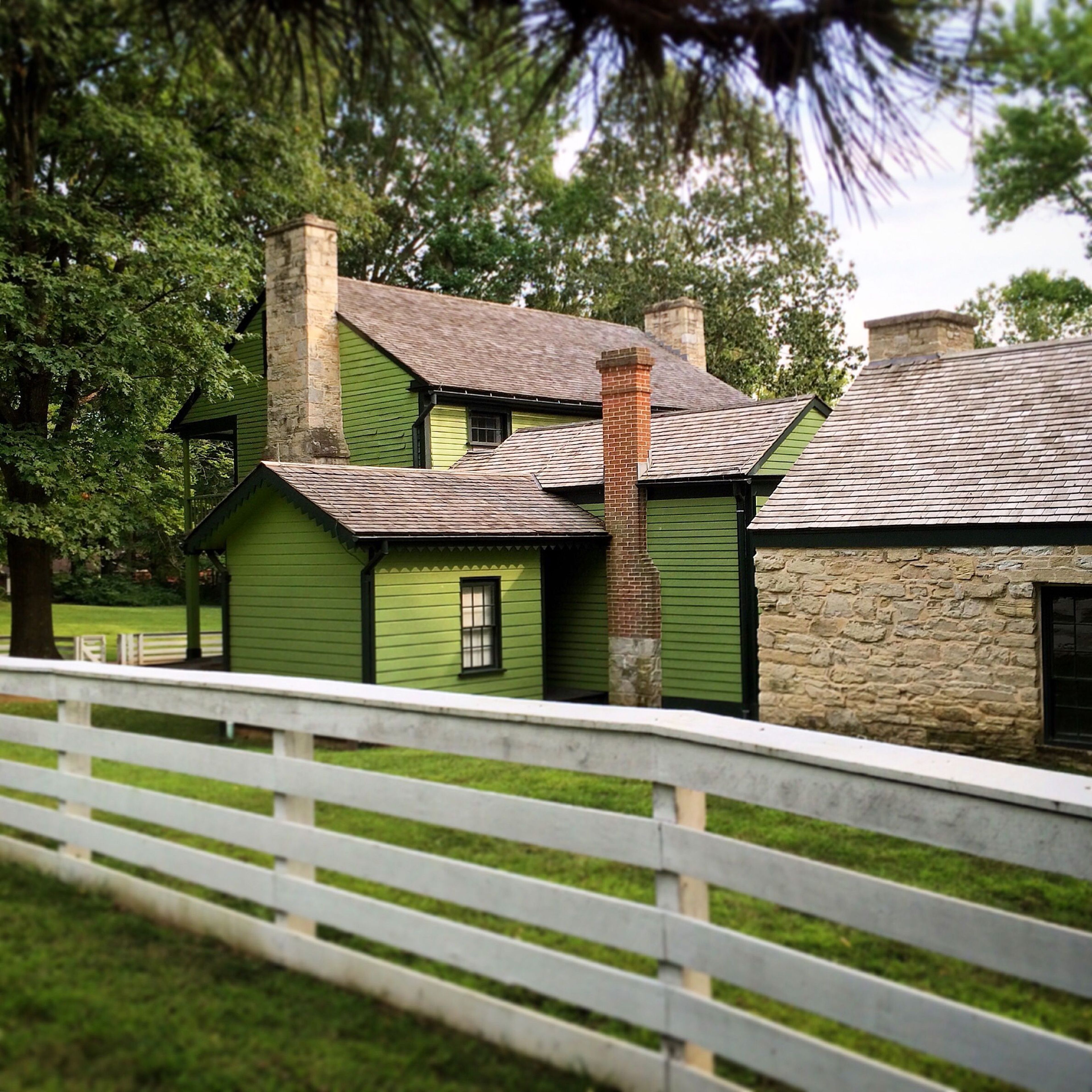 Behind the house is stone summer kitchen.