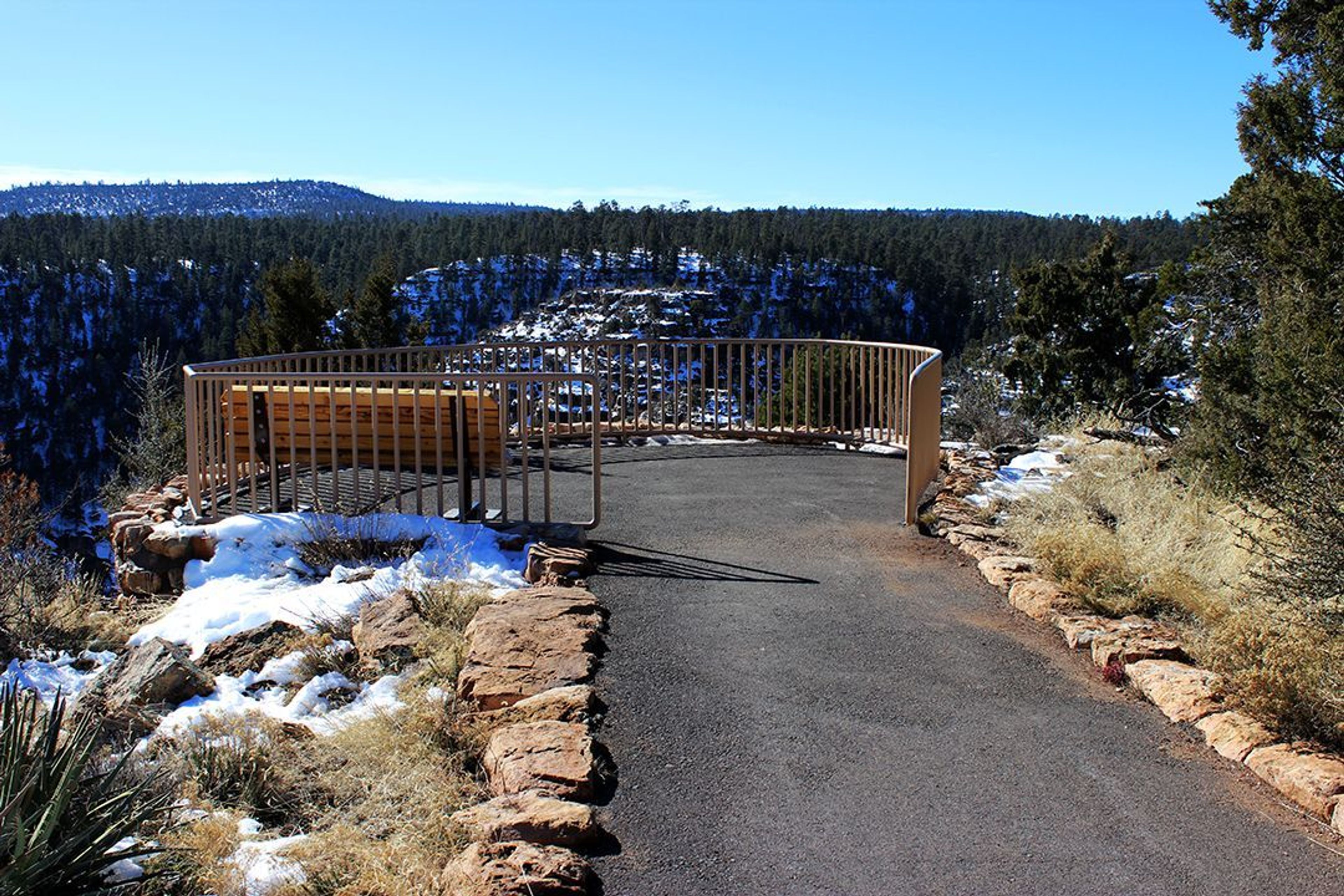 The 0.7-mile (1.1 km) Rim Trail reveals expansive views of Walnut Canyon and its cliff dwellings.