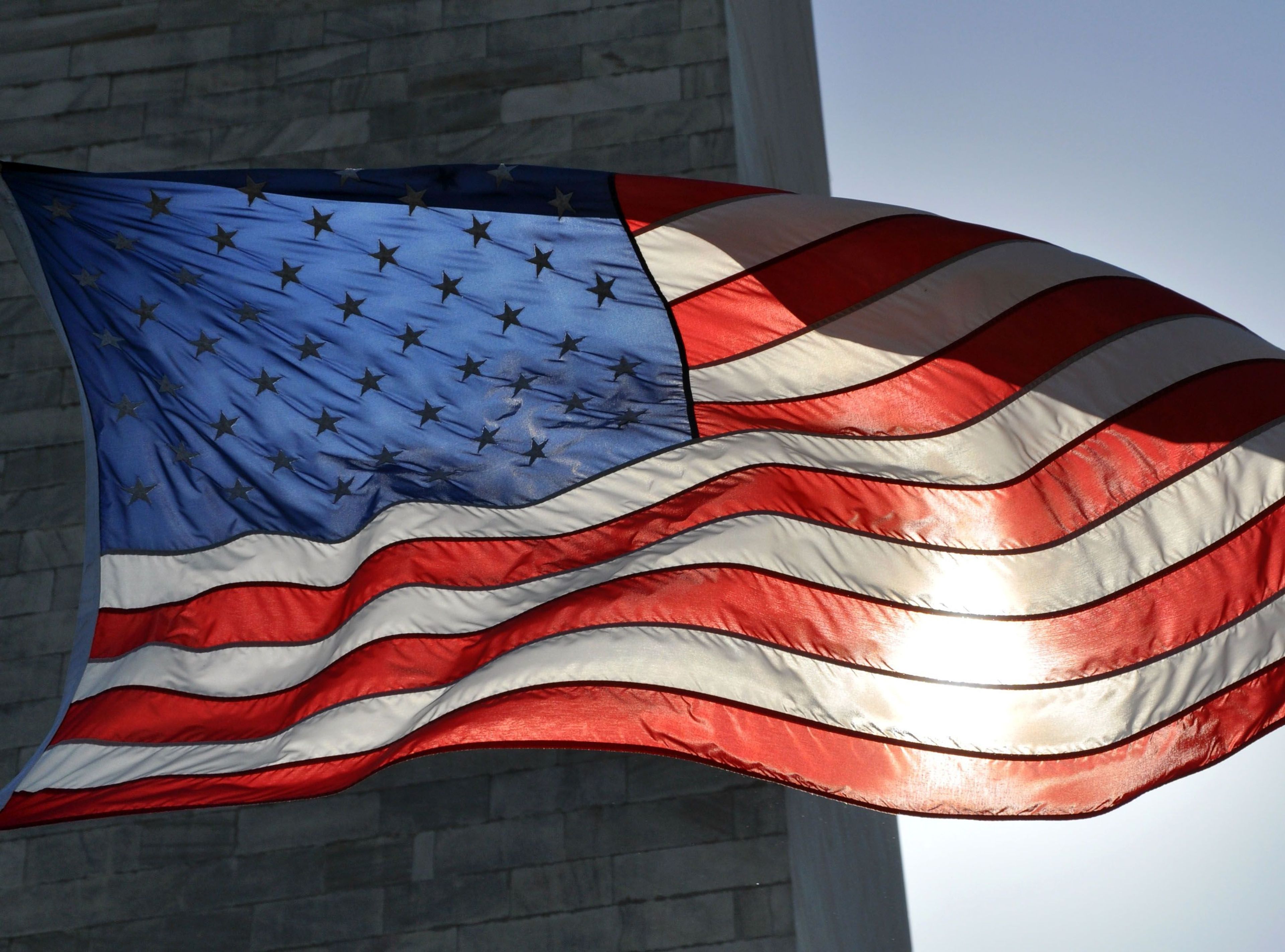 One of fifty flags flying around the base of the Monument