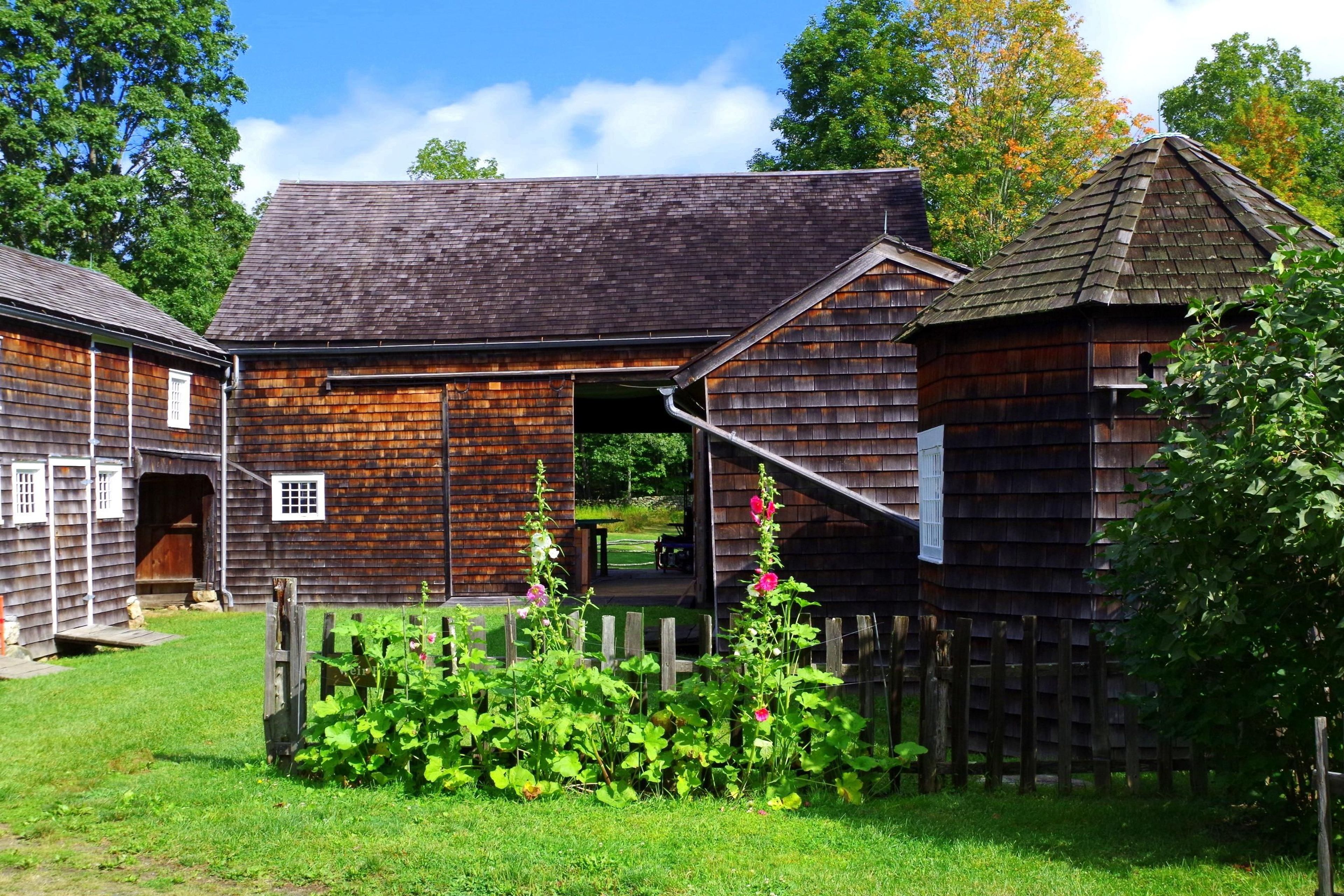 The Weir Barn and its outbuildings - the tack house, chicken coop, ice house, and corn crib - were crucial to the working farm.